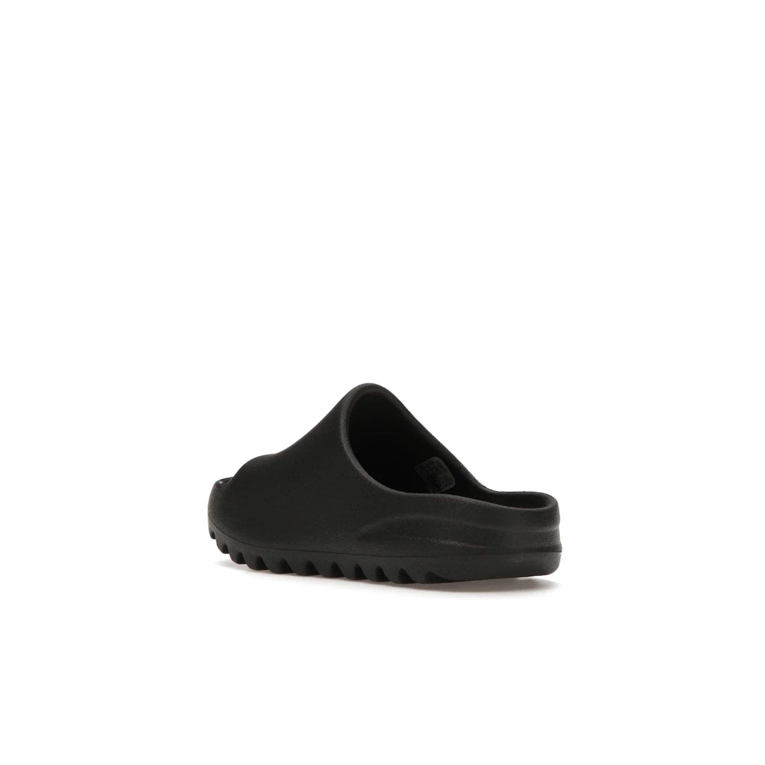 adidas Yeezy Slide Onyx (Kids) - Image 24 - Only at www.BallersClubKickz.com - adidas Yeezy Slide Onyx (Kids): Comfortable foam construction with textured surface and iconic three-stripe logo. Breathable, open-toe design and deep grooves for traction. Released in March 2021 at $50.