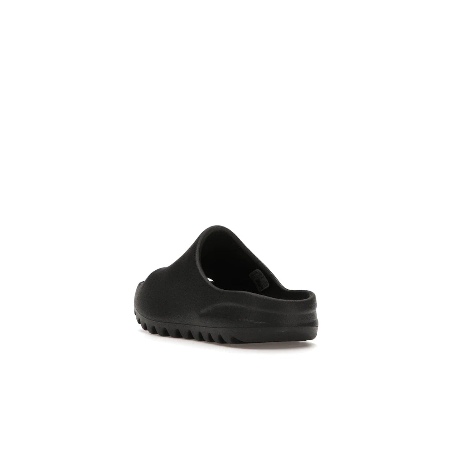 adidas Yeezy Slide Onyx (Kids) - Image 25 - Only at www.BallersClubKickz.com - adidas Yeezy Slide Onyx (Kids): Comfortable foam construction with textured surface and iconic three-stripe logo. Breathable, open-toe design and deep grooves for traction. Released in March 2021 at $50.