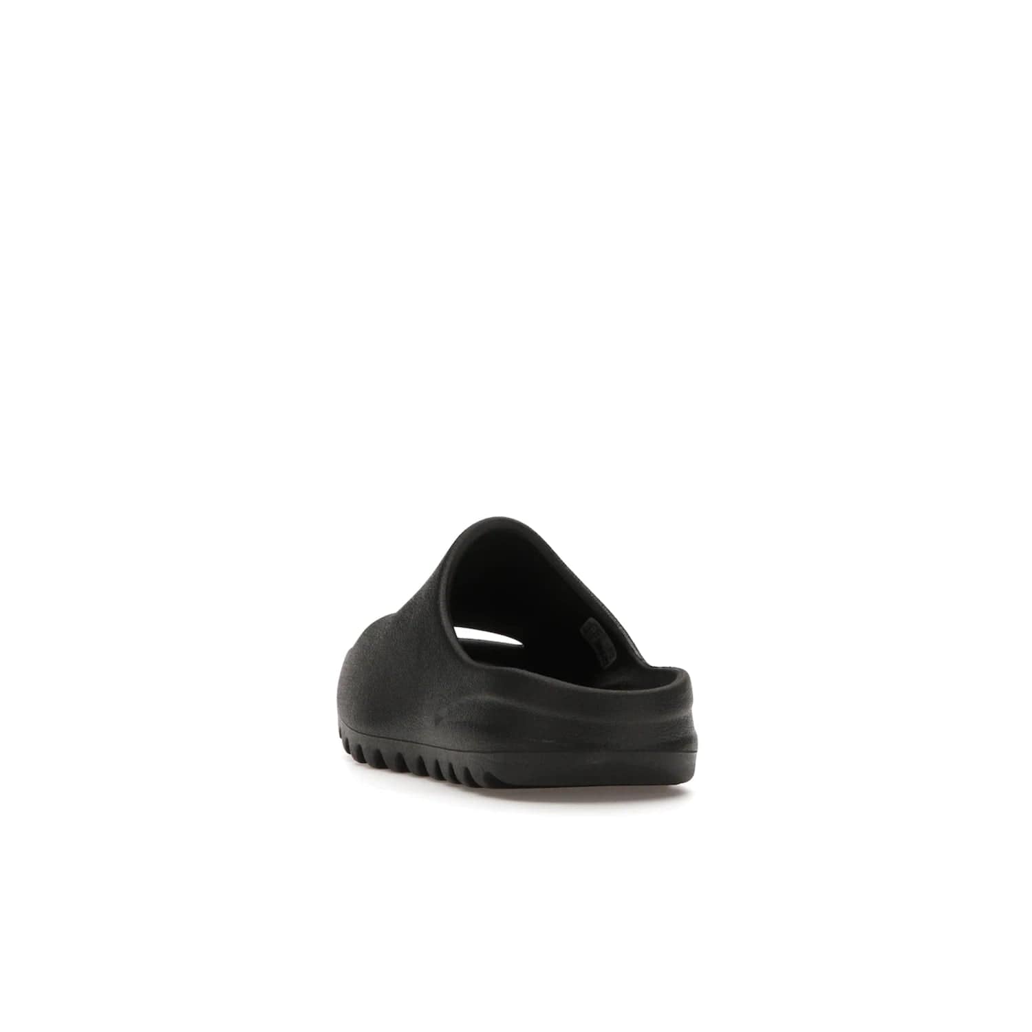 adidas Yeezy Slide Onyx (Kids) - Image 26 - Only at www.BallersClubKickz.com - adidas Yeezy Slide Onyx (Kids): Comfortable foam construction with textured surface and iconic three-stripe logo. Breathable, open-toe design and deep grooves for traction. Released in March 2021 at $50.