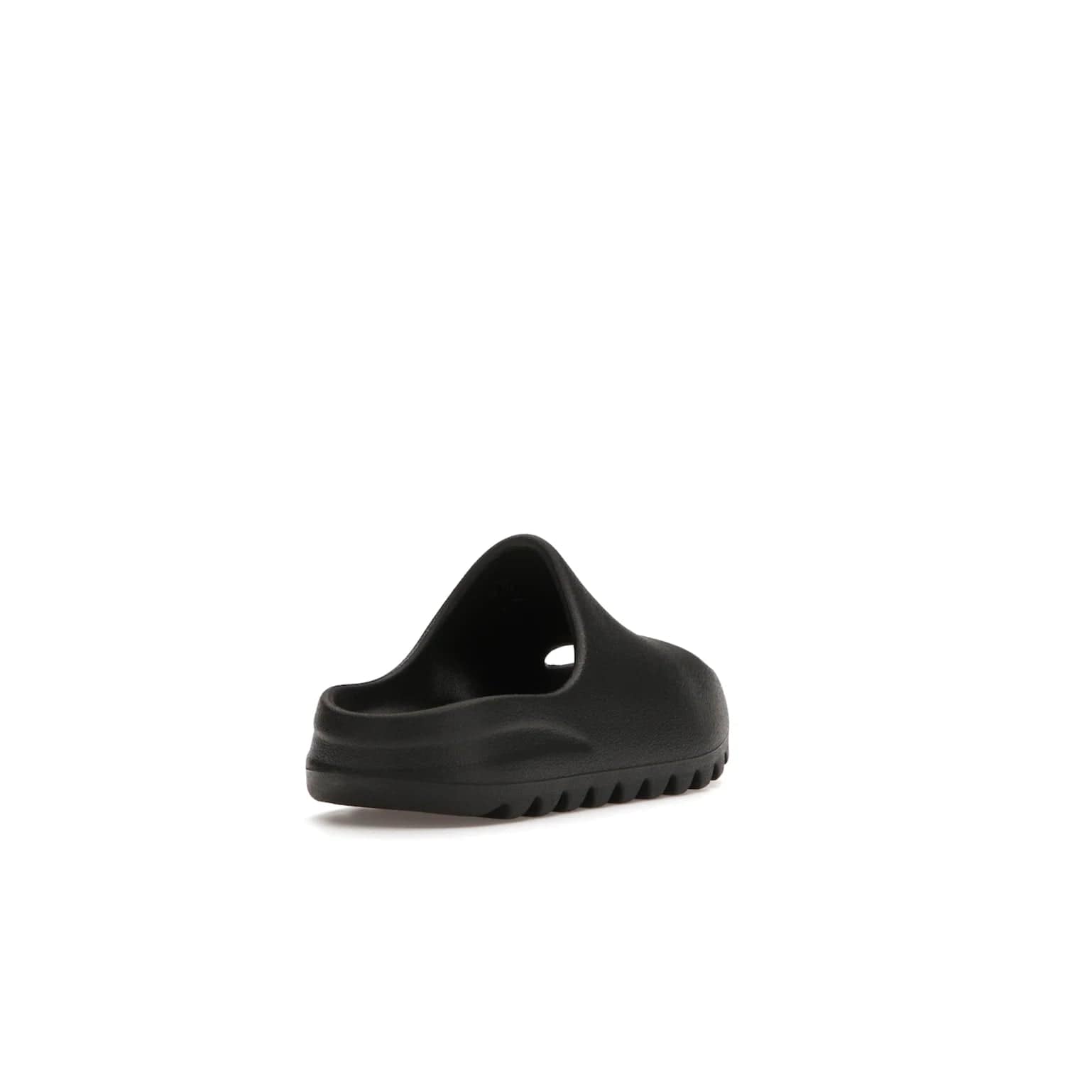 adidas Yeezy Slide Onyx (Kids) - Image 31 - Only at www.BallersClubKickz.com - adidas Yeezy Slide Onyx (Kids): Comfortable foam construction with textured surface and iconic three-stripe logo. Breathable, open-toe design and deep grooves for traction. Released in March 2021 at $50.