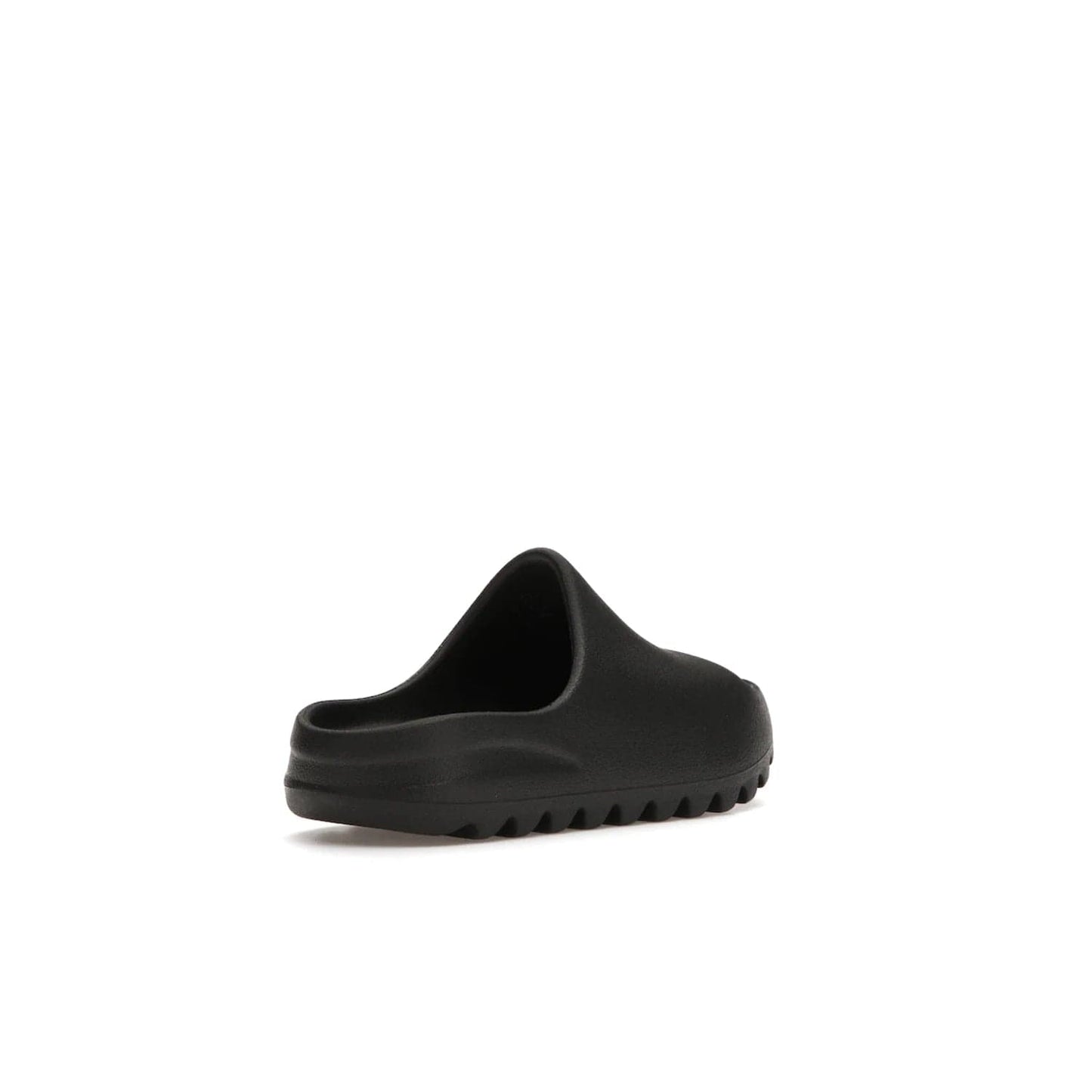 adidas Yeezy Slide Onyx (Kids) - Image 32 - Only at www.BallersClubKickz.com - adidas Yeezy Slide Onyx (Kids): Comfortable foam construction with textured surface and iconic three-stripe logo. Breathable, open-toe design and deep grooves for traction. Released in March 2021 at $50.