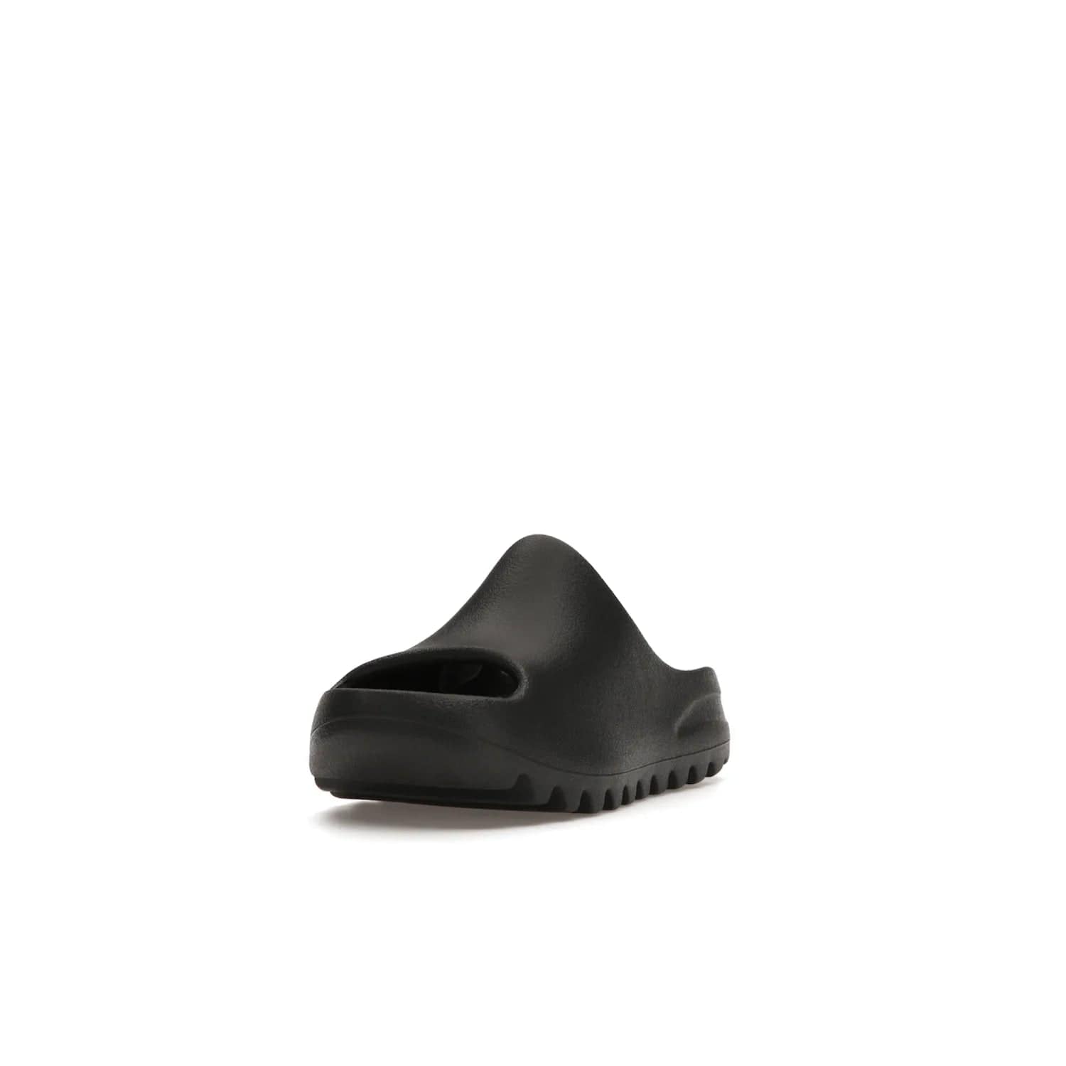 adidas Yeezy Slide Onyx (Kids) - Image 13 - Only at www.BallersClubKickz.com - adidas Yeezy Slide Onyx (Kids): Comfortable foam construction with textured surface and iconic three-stripe logo. Breathable, open-toe design and deep grooves for traction. Released in March 2021 at $50.