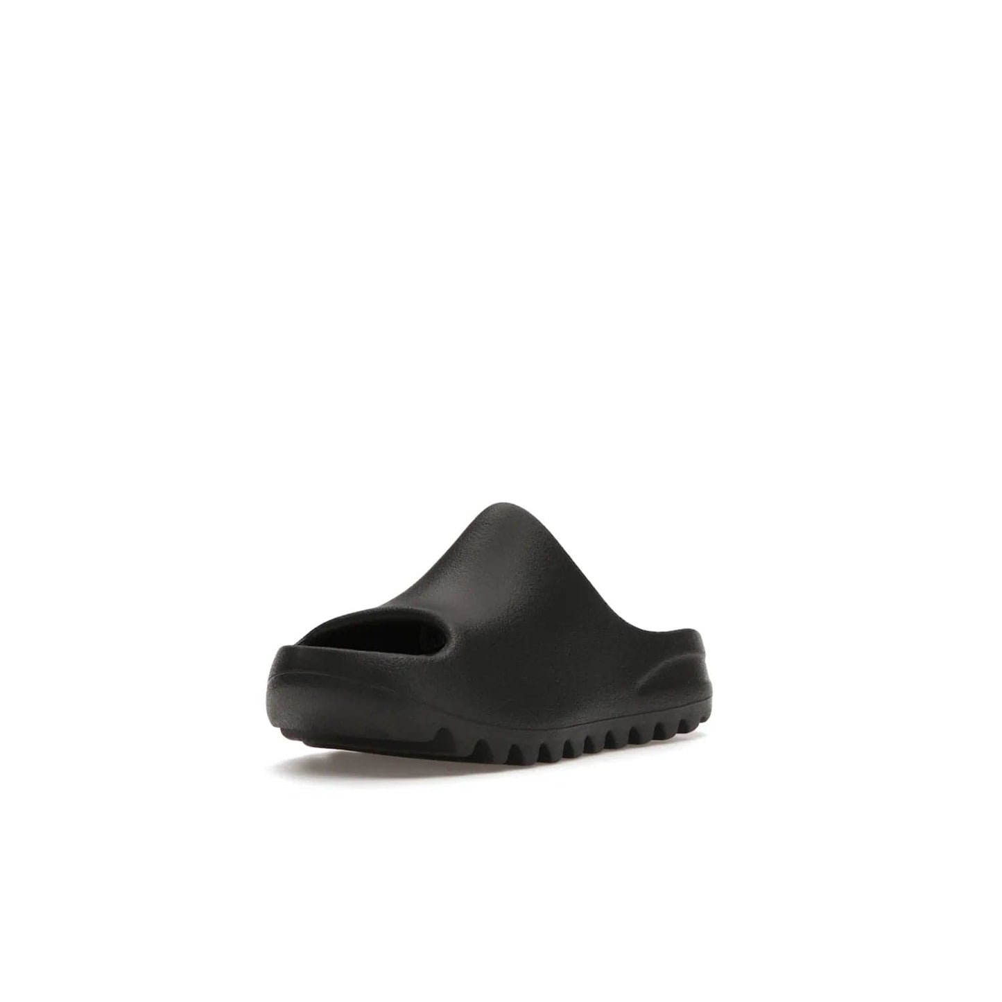 adidas Yeezy Slide Onyx (Kids) - Image 14 - Only at www.BallersClubKickz.com - adidas Yeezy Slide Onyx (Kids): Comfortable foam construction with textured surface and iconic three-stripe logo. Breathable, open-toe design and deep grooves for traction. Released in March 2021 at $50.