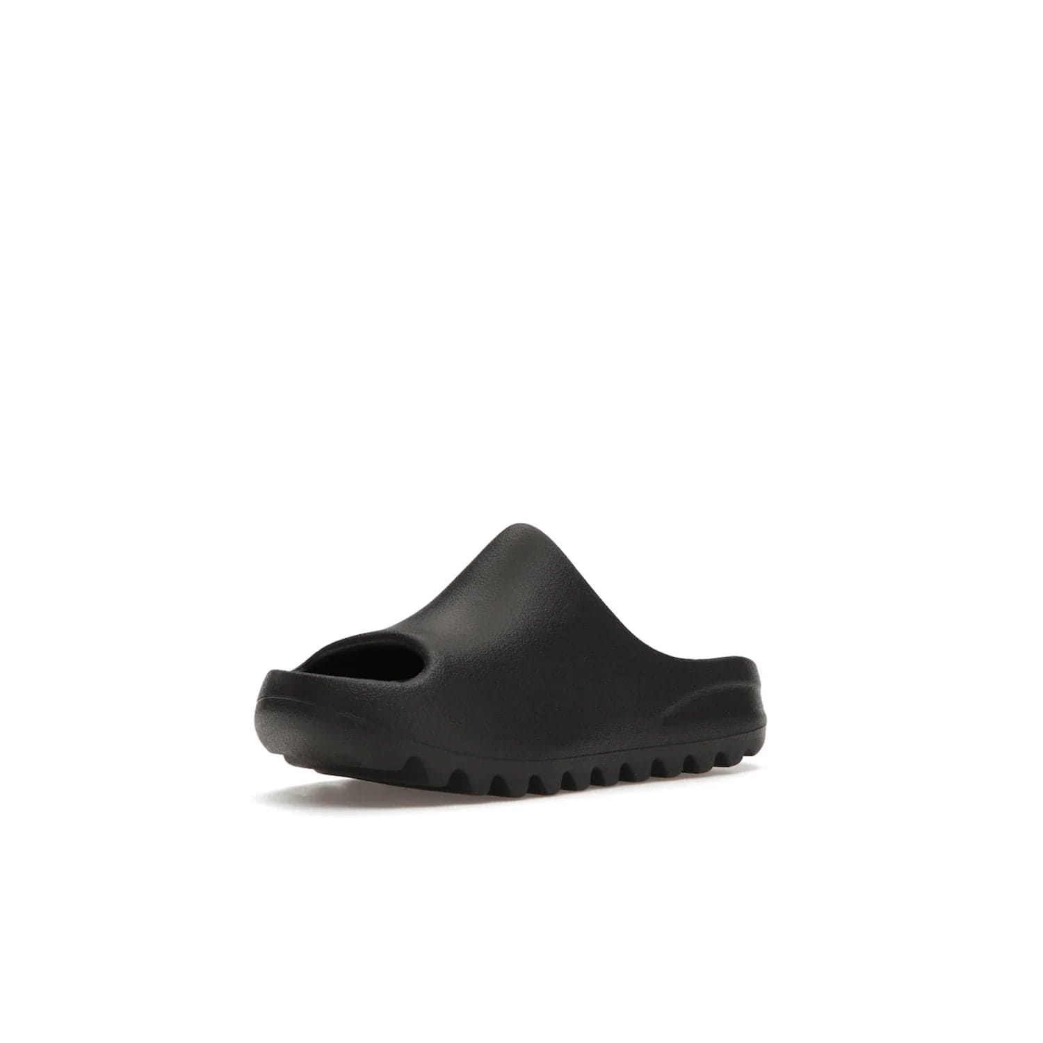 adidas Yeezy Slide Onyx (Kids) - Image 15 - Only at www.BallersClubKickz.com - adidas Yeezy Slide Onyx (Kids): Comfortable foam construction with textured surface and iconic three-stripe logo. Breathable, open-toe design and deep grooves for traction. Released in March 2021 at $50.