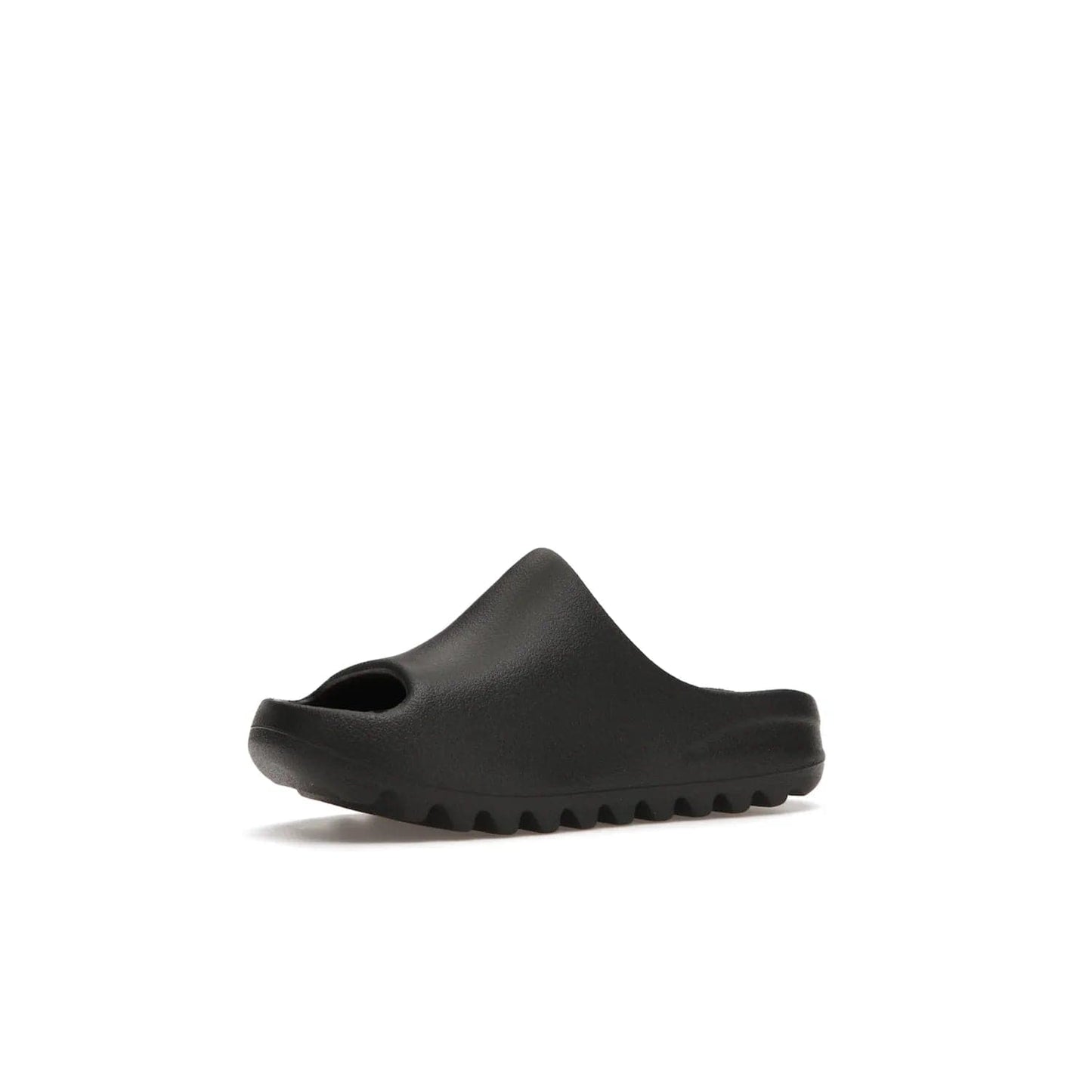 adidas Yeezy Slide Onyx (Kids) - Image 16 - Only at www.BallersClubKickz.com - adidas Yeezy Slide Onyx (Kids): Comfortable foam construction with textured surface and iconic three-stripe logo. Breathable, open-toe design and deep grooves for traction. Released in March 2021 at $50.