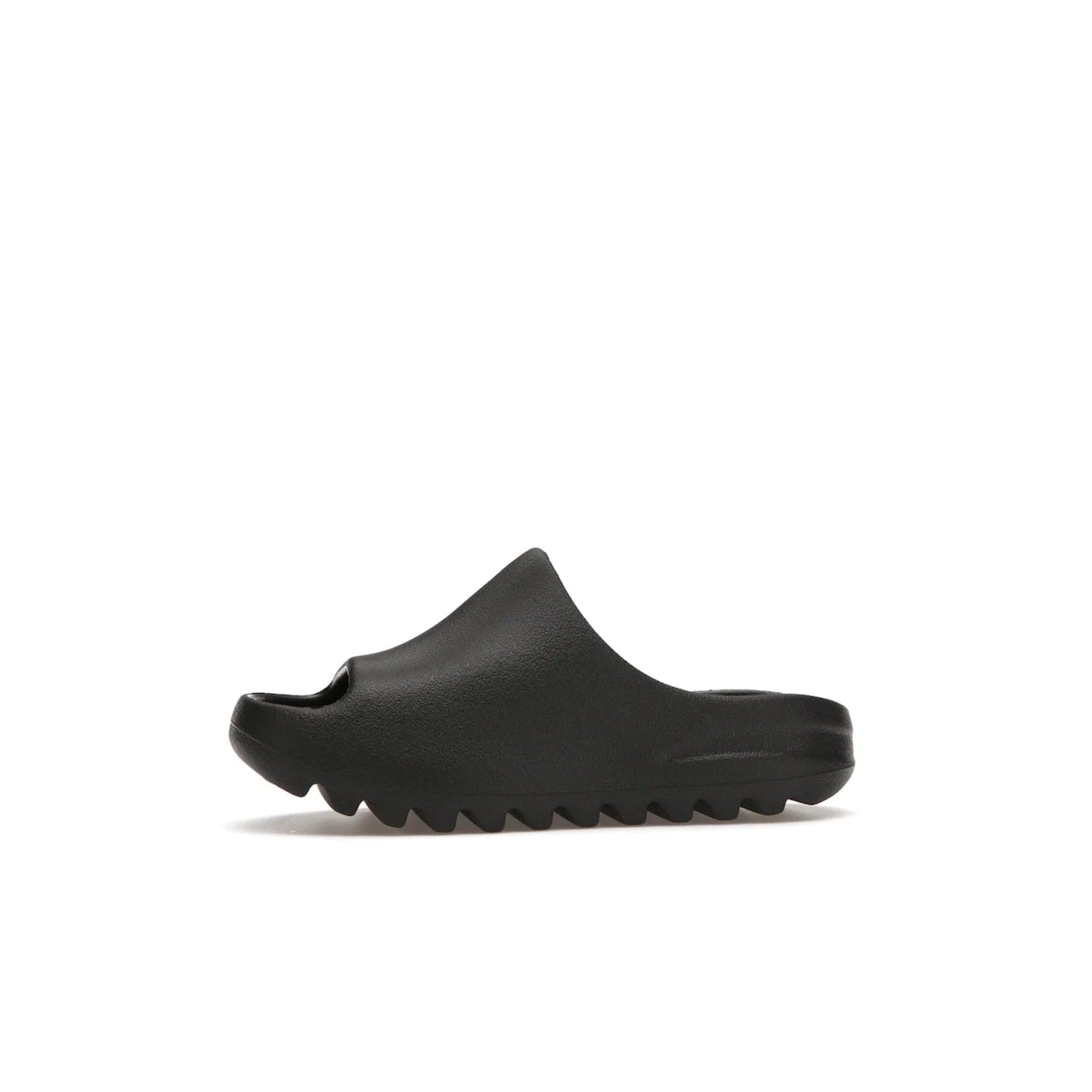 adidas Yeezy Slide Onyx (Kids) - Image 18 - Only at www.BallersClubKickz.com - adidas Yeezy Slide Onyx (Kids): Comfortable foam construction with textured surface and iconic three-stripe logo. Breathable, open-toe design and deep grooves for traction. Released in March 2021 at $50.