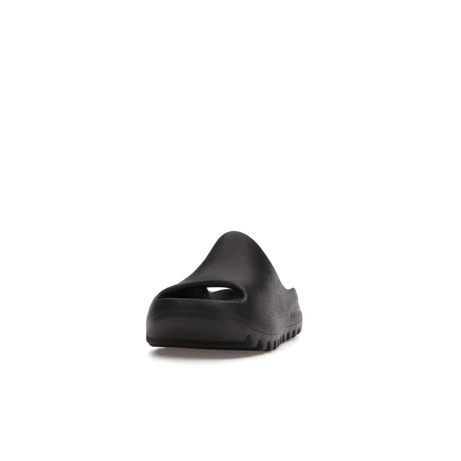 adidas Yeezy Slide Onyx (Kids) - Image 12 - Only at www.BallersClubKickz.com - adidas Yeezy Slide Onyx (Kids): Comfortable foam construction with textured surface and iconic three-stripe logo. Breathable, open-toe design and deep grooves for traction. Released in March 2021 at $50.