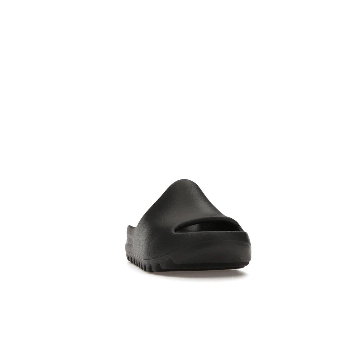 adidas Yeezy Slide Onyx (Kids) - Image 8 - Only at www.BallersClubKickz.com - adidas Yeezy Slide Onyx (Kids): Comfortable foam construction with textured surface and iconic three-stripe logo. Breathable, open-toe design and deep grooves for traction. Released in March 2021 at $50.