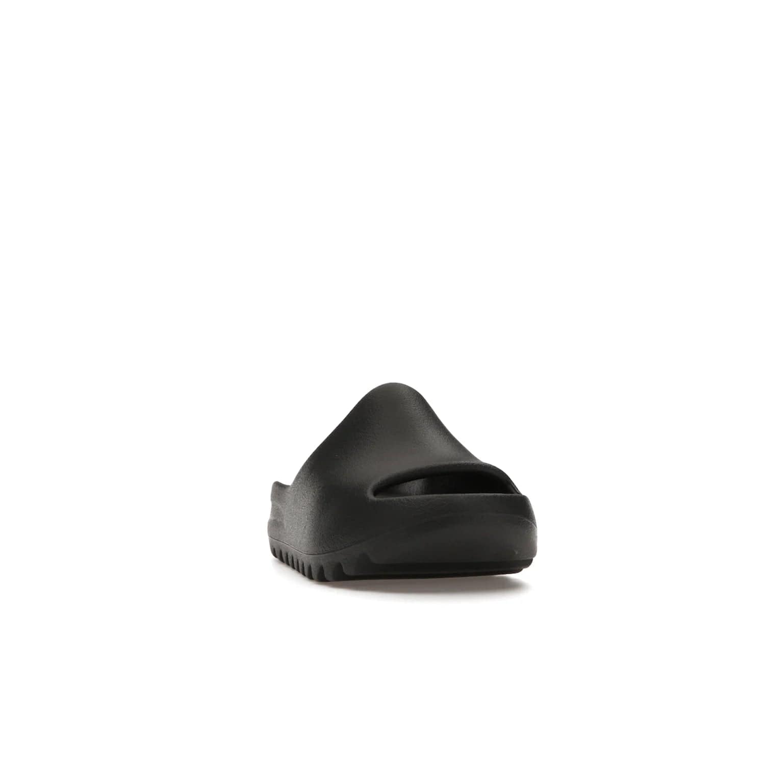 adidas Yeezy Slide Onyx (Kids) - Image 8 - Only at www.BallersClubKickz.com - adidas Yeezy Slide Onyx (Kids): Comfortable foam construction with textured surface and iconic three-stripe logo. Breathable, open-toe design and deep grooves for traction. Released in March 2021 at $50.