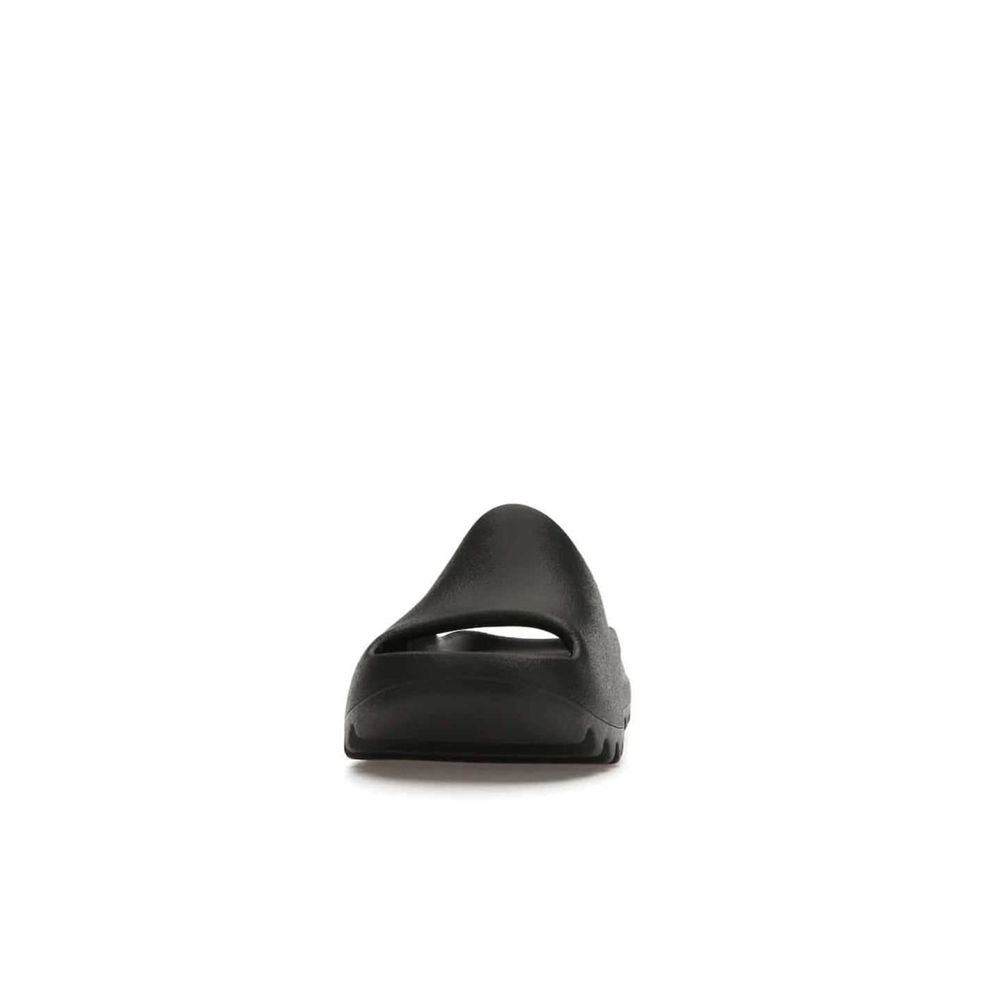adidas Yeezy Slide Onyx (Kids) - Image 11 - Only at www.BallersClubKickz.com - adidas Yeezy Slide Onyx (Kids): Comfortable foam construction with textured surface and iconic three-stripe logo. Breathable, open-toe design and deep grooves for traction. Released in March 2021 at $50.