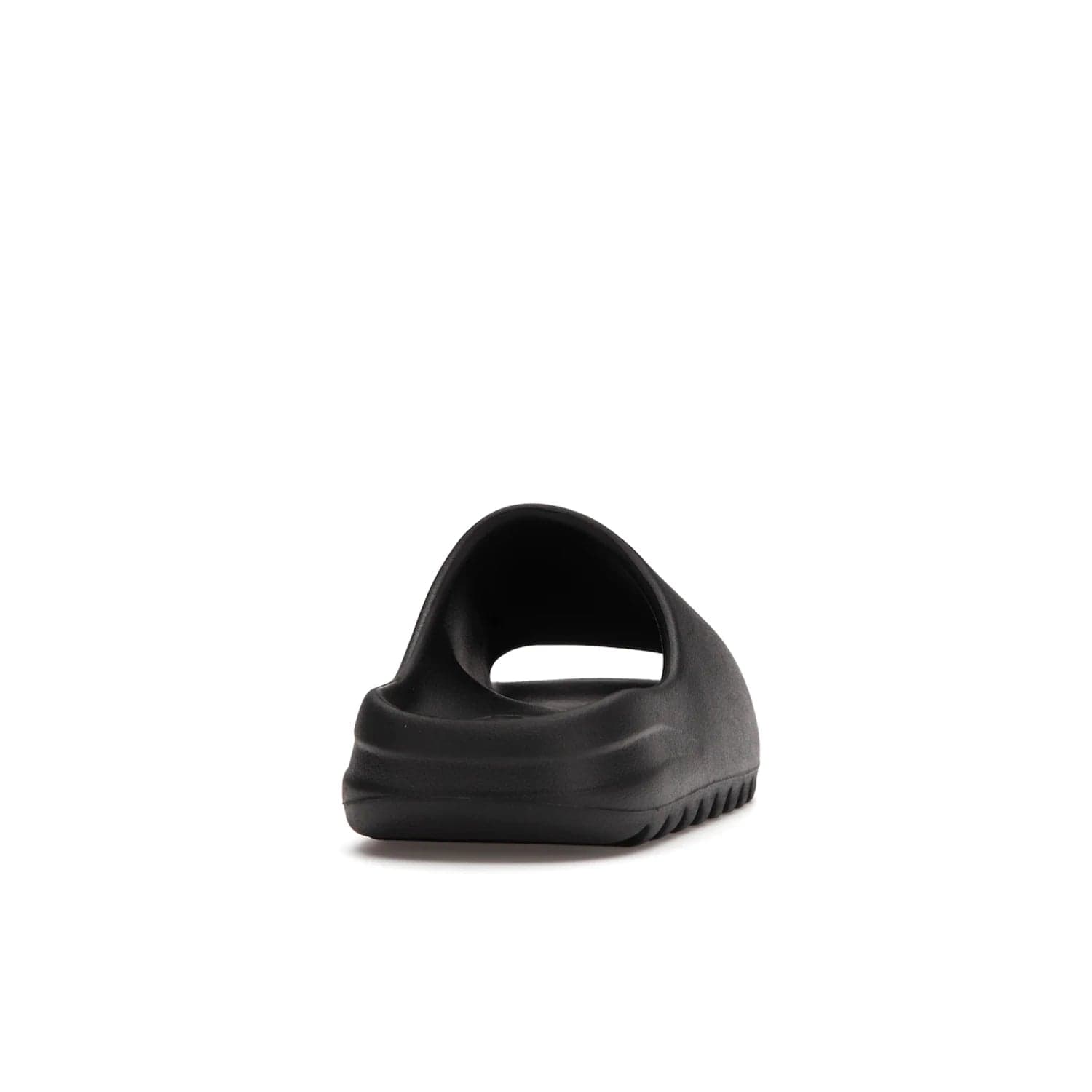 adidas Yeezy Slide Onyx - Image 29 - Only at www.BallersClubKickz.com - Step into comfort and style with the adidas Yeezy Slide Onyx. Featuring foam construction, an all-black colorway and a grooved outsole for stability and responsiveness, this versatile slide is a must-have for your collection.