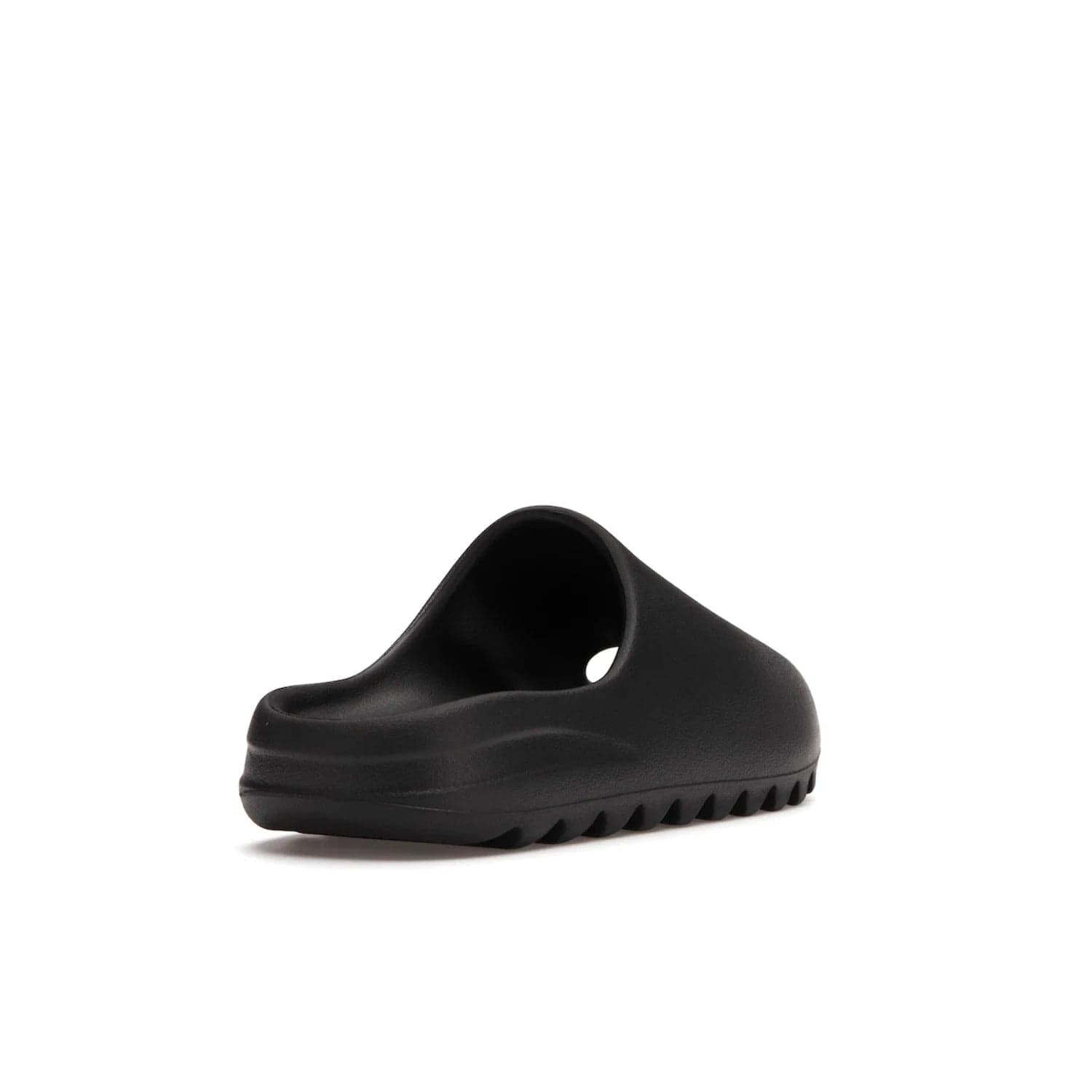adidas Yeezy Slide Onyx - Image 31 - Only at www.BallersClubKickz.com - Step into comfort and style with the adidas Yeezy Slide Onyx. Featuring foam construction, an all-black colorway and a grooved outsole for stability and responsiveness, this versatile slide is a must-have for your collection.