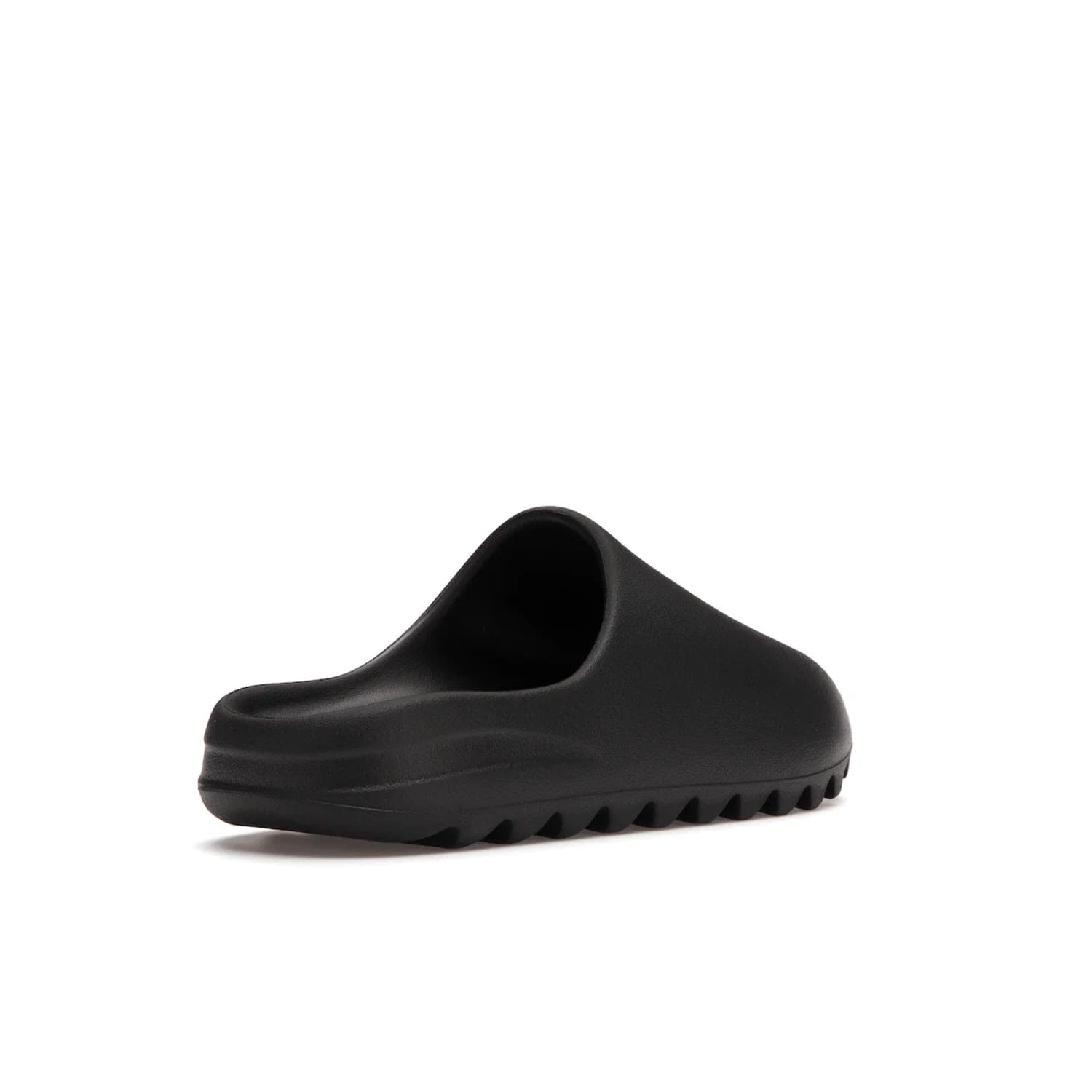 adidas Yeezy Slide Onyx - Image 32 - Only at www.BallersClubKickz.com - Step into comfort and style with the adidas Yeezy Slide Onyx. Featuring foam construction, an all-black colorway and a grooved outsole for stability and responsiveness, this versatile slide is a must-have for your collection.