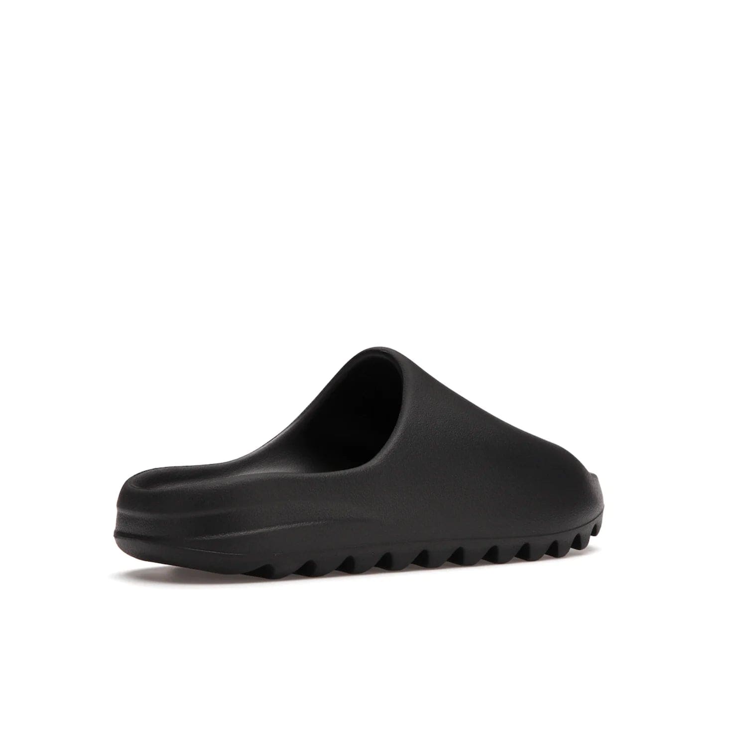 adidas Yeezy Slide Onyx - Image 33 - Only at www.BallersClubKickz.com - Step into comfort and style with the adidas Yeezy Slide Onyx. Featuring foam construction, an all-black colorway and a grooved outsole for stability and responsiveness, this versatile slide is a must-have for your collection.