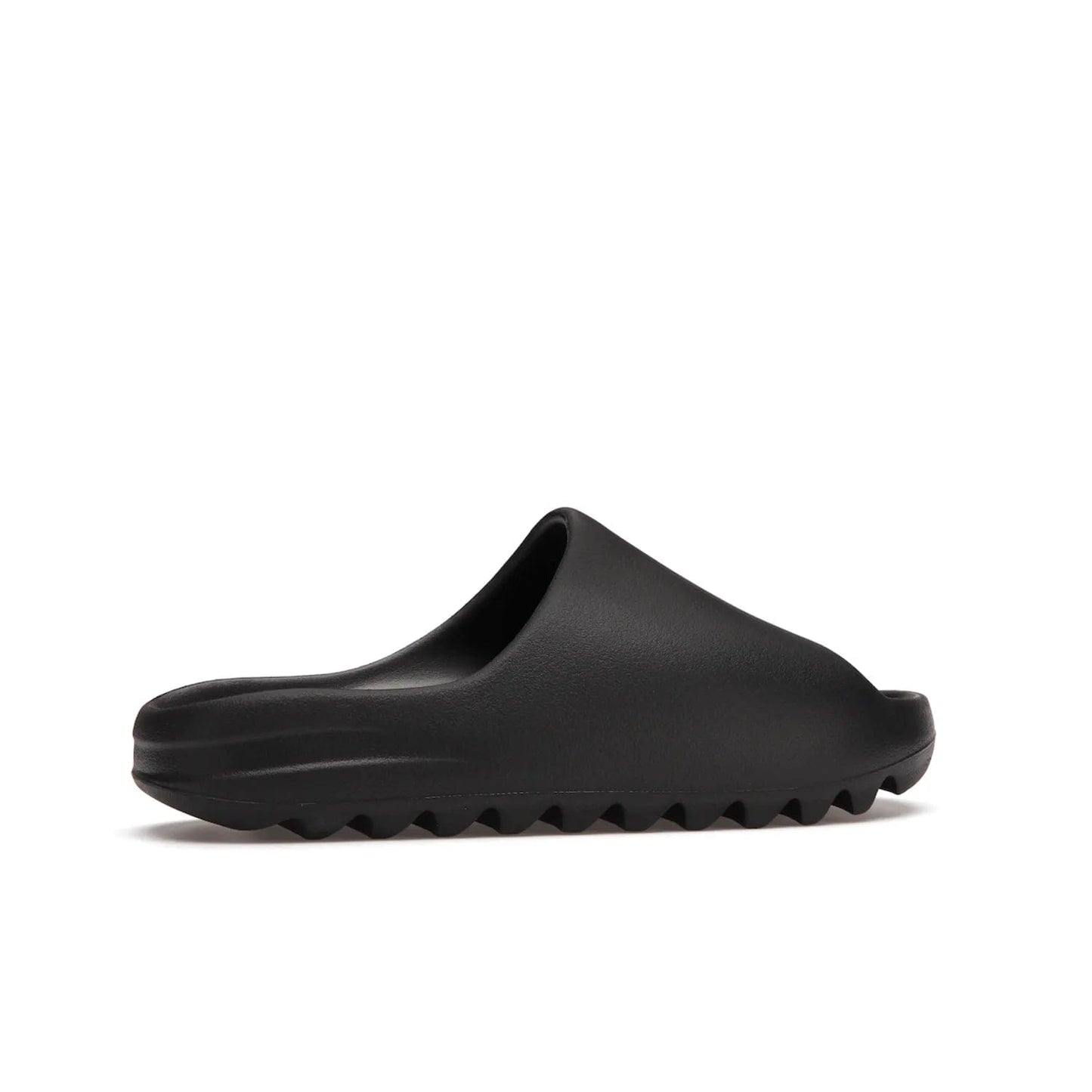 adidas Yeezy Slide Onyx - Image 35 - Only at www.BallersClubKickz.com - Step into comfort and style with the adidas Yeezy Slide Onyx. Featuring foam construction, an all-black colorway and a grooved outsole for stability and responsiveness, this versatile slide is a must-have for your collection.
