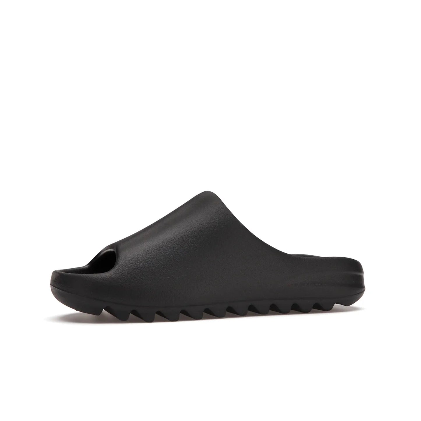 adidas Yeezy Slide Onyx - Image 17 - Only at www.BallersClubKickz.com - Step into comfort and style with the adidas Yeezy Slide Onyx. Featuring foam construction, an all-black colorway and a grooved outsole for stability and responsiveness, this versatile slide is a must-have for your collection.