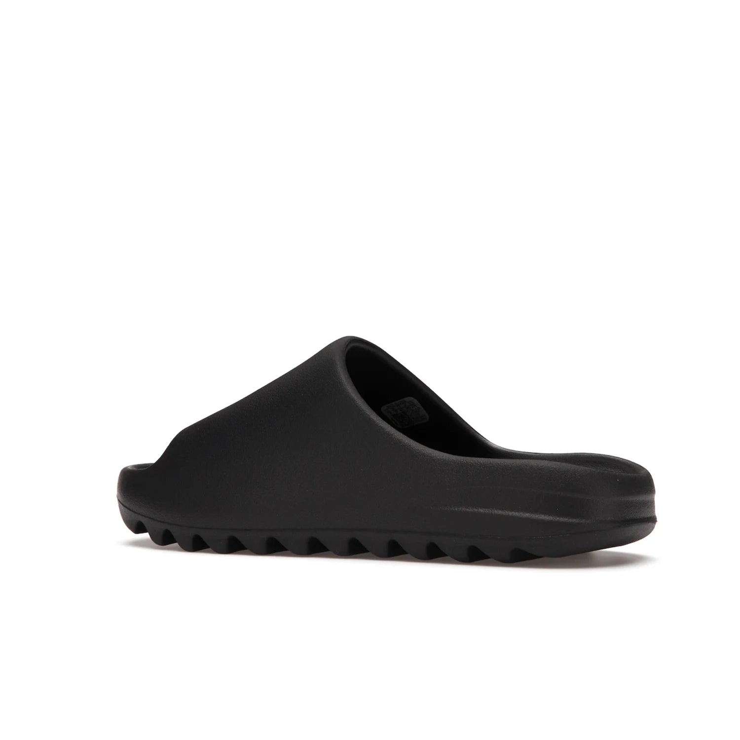 adidas Yeezy Slide Onyx - Image 22 - Only at www.BallersClubKickz.com - Step into comfort and style with the adidas Yeezy Slide Onyx. Featuring foam construction, an all-black colorway and a grooved outsole for stability and responsiveness, this versatile slide is a must-have for your collection.