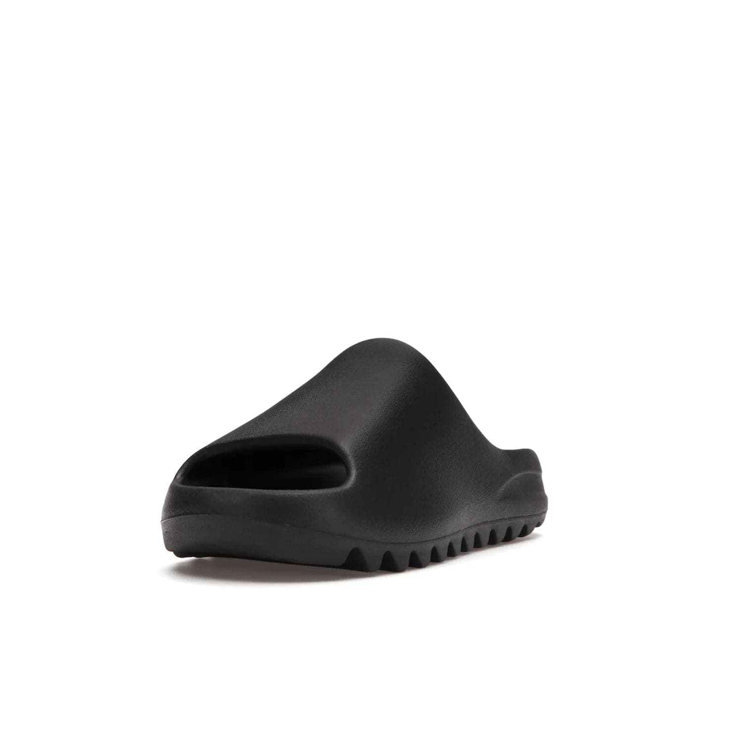 adidas Yeezy Slide Onyx - Image 13 - Only at www.BallersClubKickz.com - Step into comfort and style with the adidas Yeezy Slide Onyx. Featuring foam construction, an all-black colorway and a grooved outsole for stability and responsiveness, this versatile slide is a must-have for your collection.