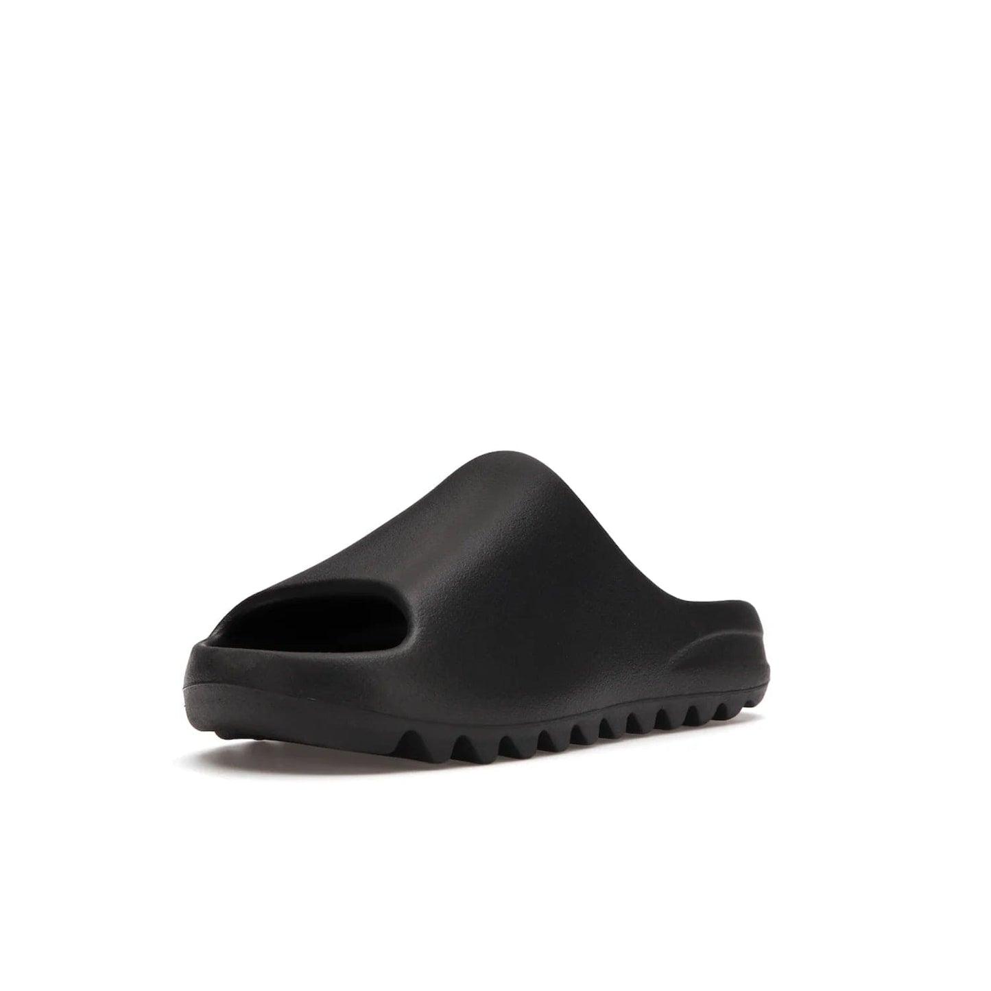 adidas Yeezy Slide Onyx - Image 14 - Only at www.BallersClubKickz.com - Step into comfort and style with the adidas Yeezy Slide Onyx. Featuring foam construction, an all-black colorway and a grooved outsole for stability and responsiveness, this versatile slide is a must-have for your collection.