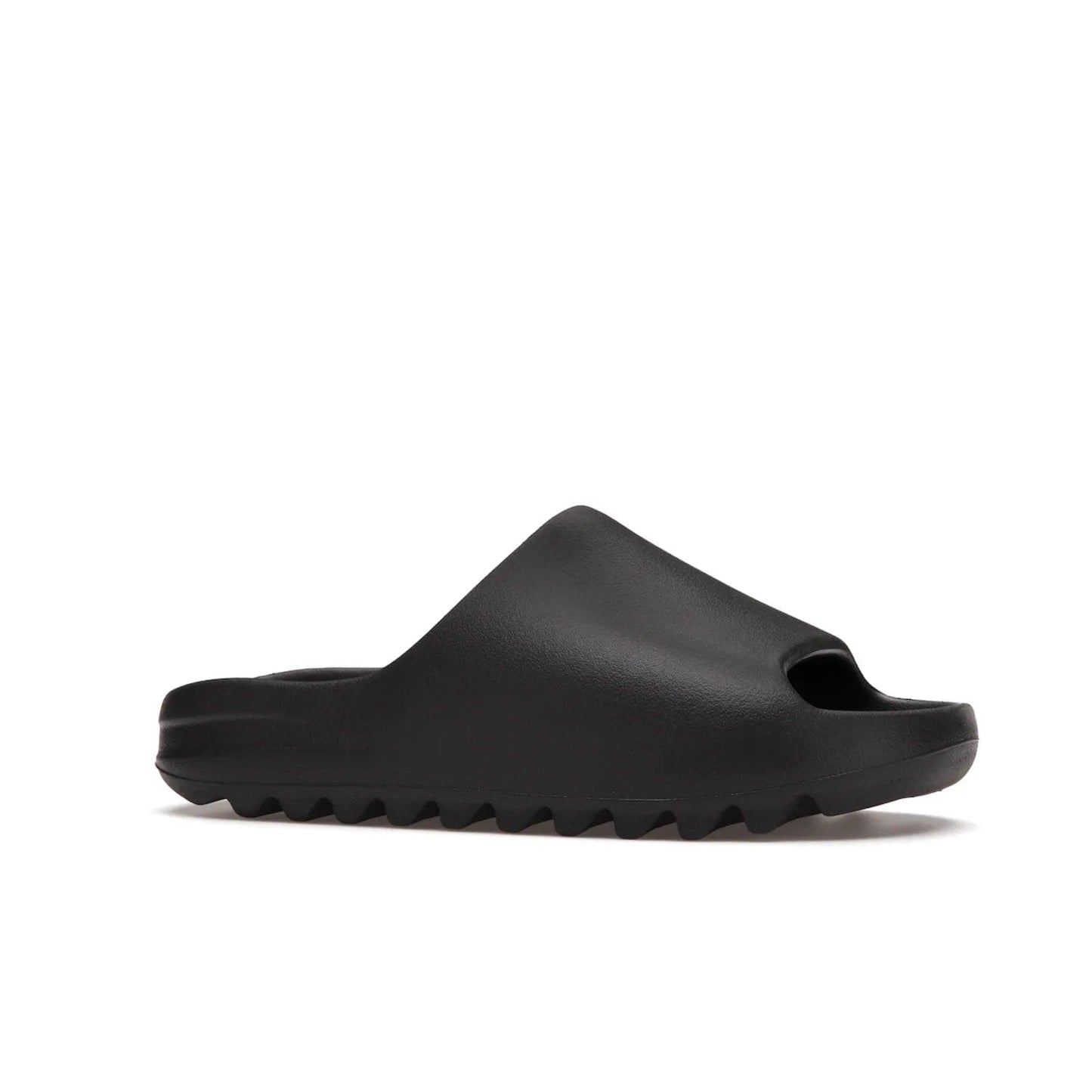adidas Yeezy Slide Onyx - Image 3 - Only at www.BallersClubKickz.com - Step into comfort and style with the adidas Yeezy Slide Onyx. Featuring foam construction, an all-black colorway and a grooved outsole for stability and responsiveness, this versatile slide is a must-have for your collection.