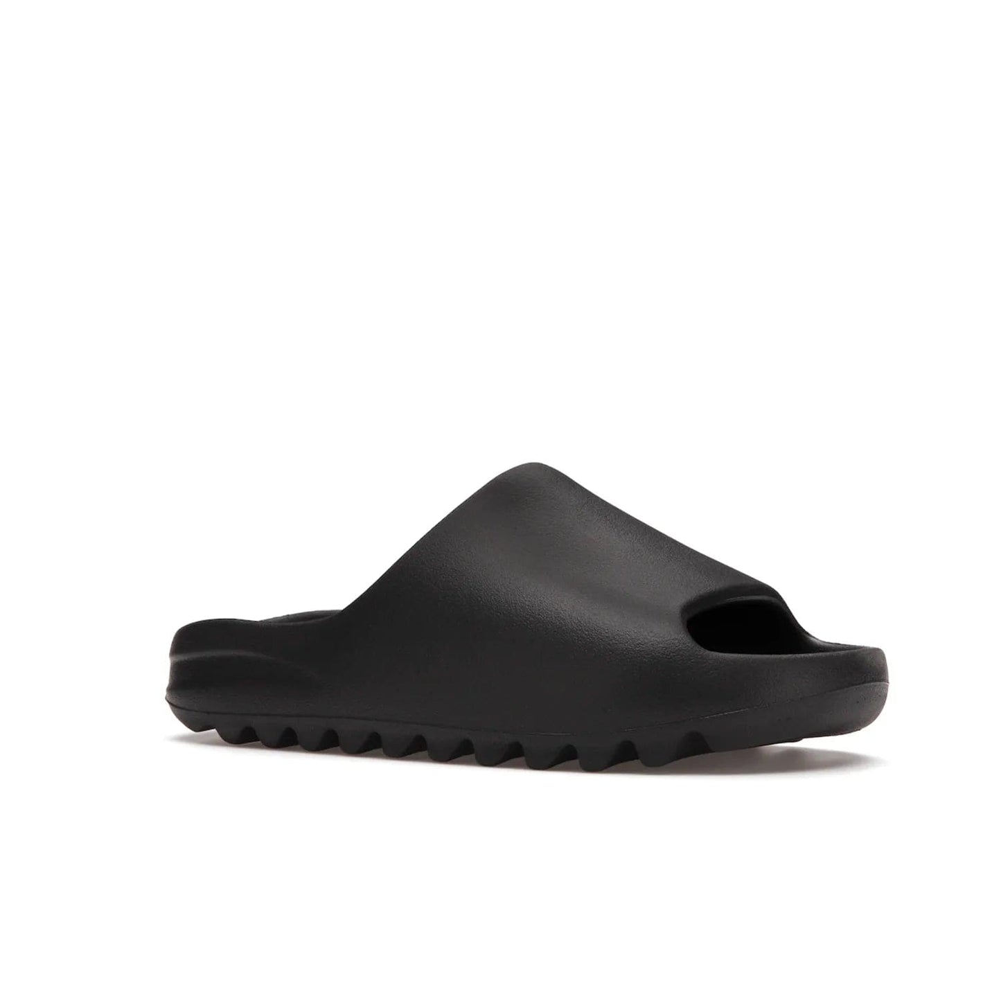 adidas Yeezy Slide Onyx - Image 4 - Only at www.BallersClubKickz.com - Step into comfort and style with the adidas Yeezy Slide Onyx. Featuring foam construction, an all-black colorway and a grooved outsole for stability and responsiveness, this versatile slide is a must-have for your collection.