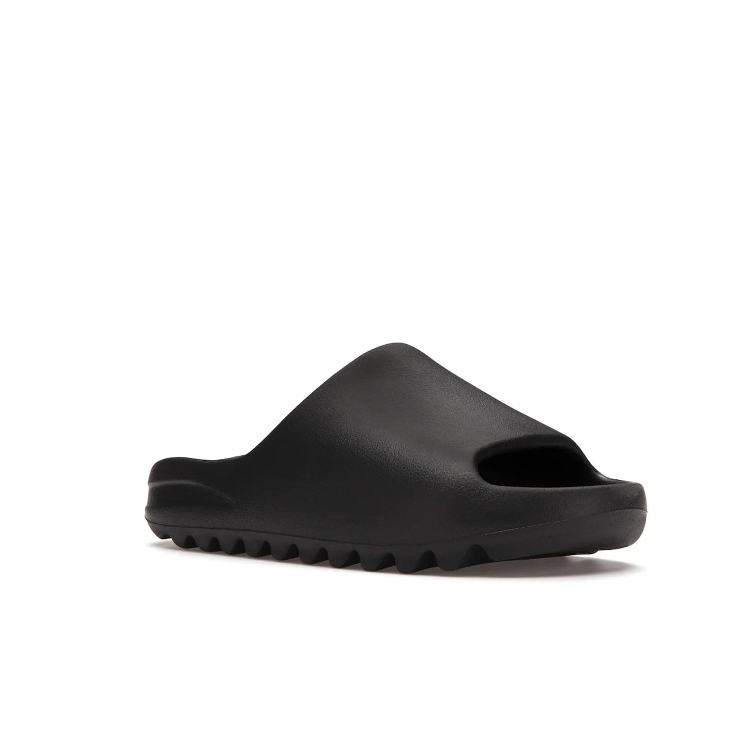adidas Yeezy Slide Onyx - Image 5 - Only at www.BallersClubKickz.com - Step into comfort and style with the adidas Yeezy Slide Onyx. Featuring foam construction, an all-black colorway and a grooved outsole for stability and responsiveness, this versatile slide is a must-have for your collection.