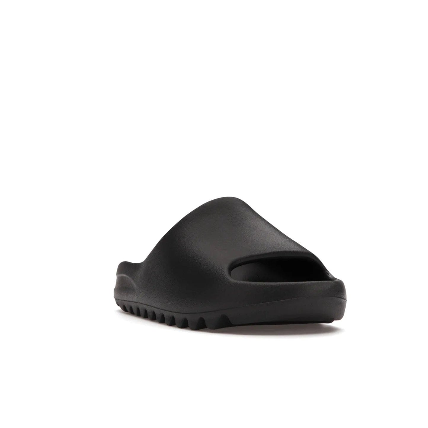 adidas Yeezy Slide Onyx - Image 7 - Only at www.BallersClubKickz.com - Step into comfort and style with the adidas Yeezy Slide Onyx. Featuring foam construction, an all-black colorway and a grooved outsole for stability and responsiveness, this versatile slide is a must-have for your collection.