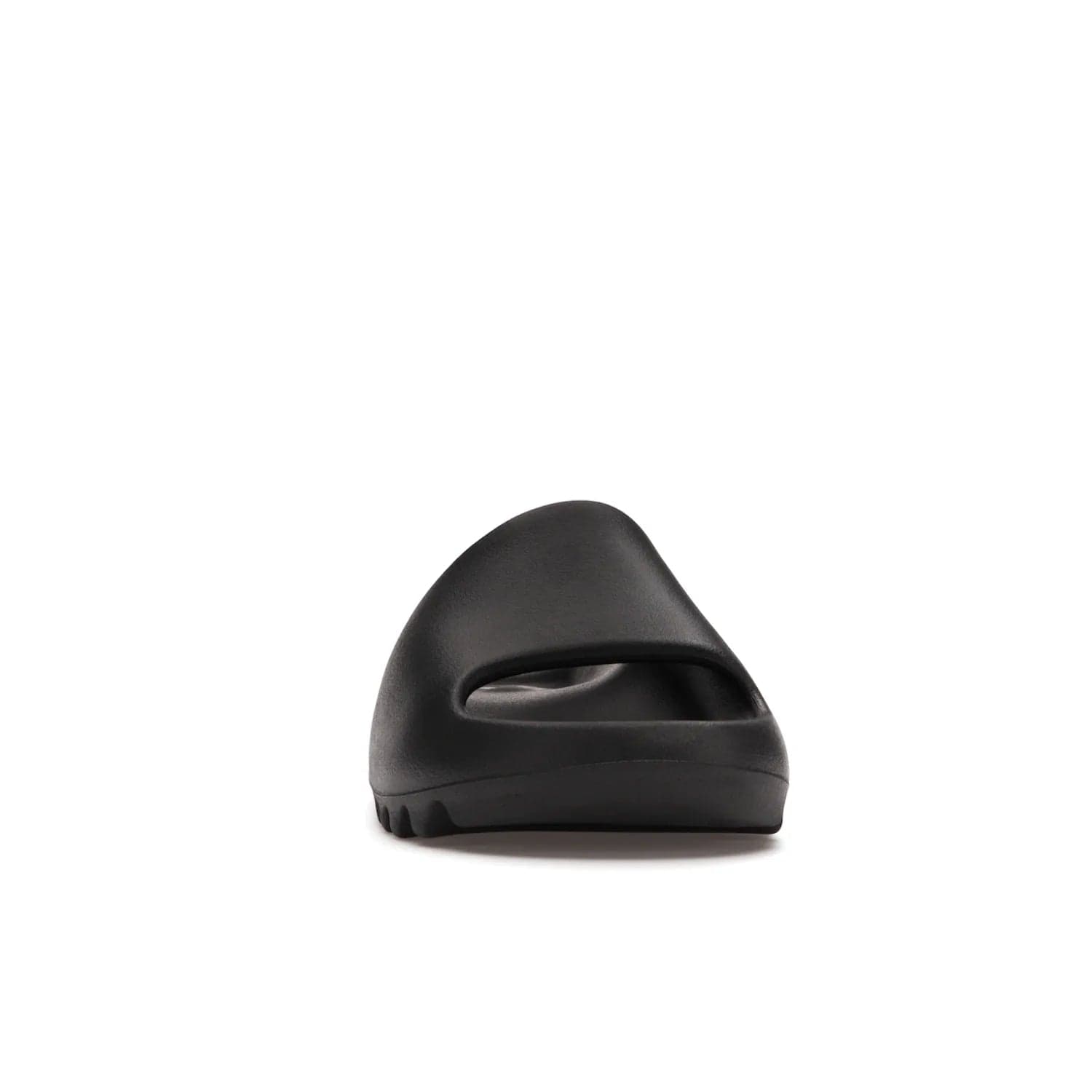 adidas Yeezy Slide Onyx - Image 9 - Only at www.BallersClubKickz.com - Step into comfort and style with the adidas Yeezy Slide Onyx. Featuring foam construction, an all-black colorway and a grooved outsole for stability and responsiveness, this versatile slide is a must-have for your collection.