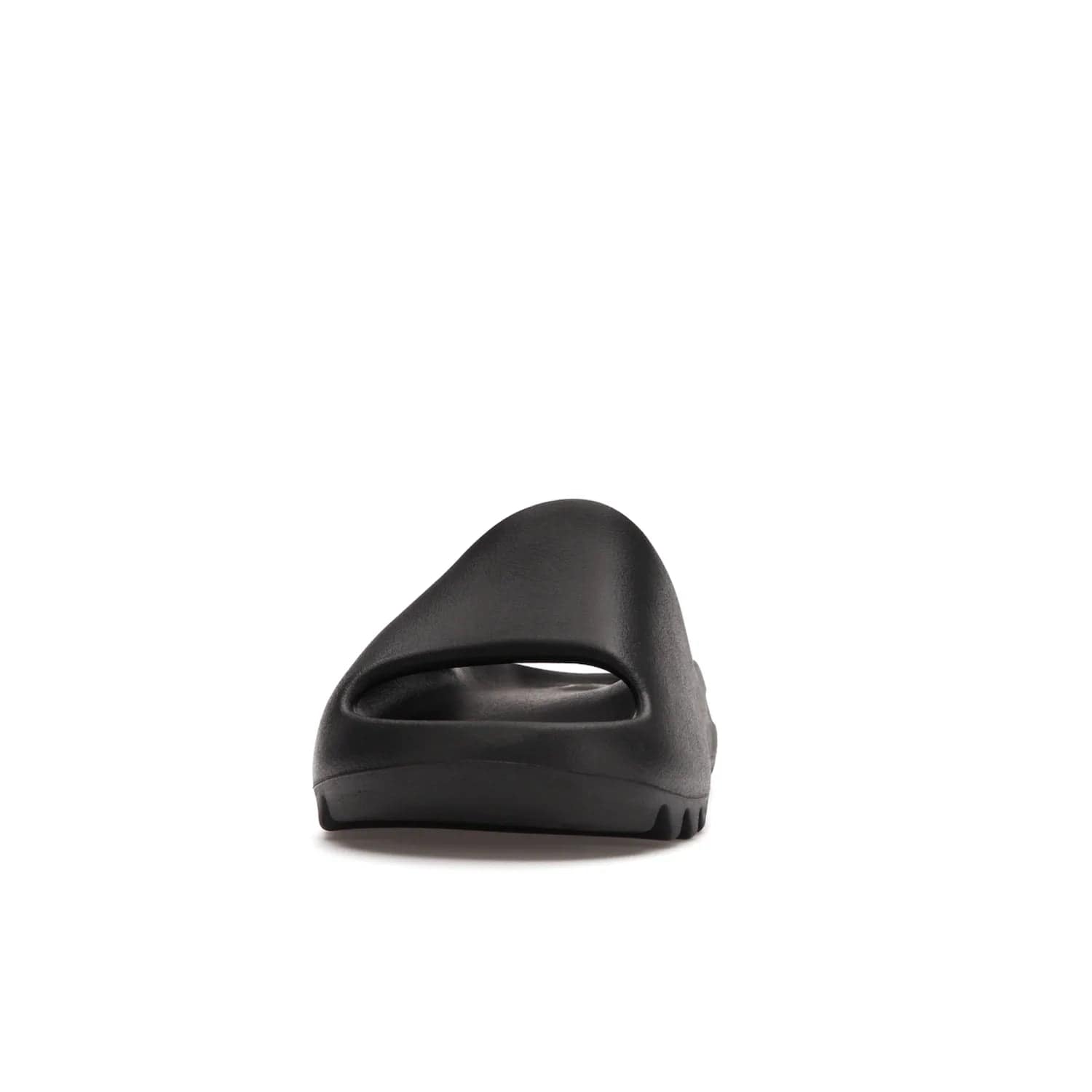 adidas Yeezy Slide Onyx - Image 11 - Only at www.BallersClubKickz.com - Step into comfort and style with the adidas Yeezy Slide Onyx. Featuring foam construction, an all-black colorway and a grooved outsole for stability and responsiveness, this versatile slide is a must-have for your collection.