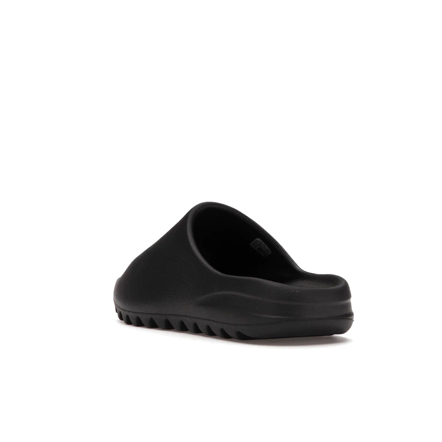 adidas Yeezy Slide Onyx - Image 25 - Only at www.BallersClubKickz.com - Step into comfort and style with the adidas Yeezy Slide Onyx. Featuring foam construction, an all-black colorway and a grooved outsole for stability and responsiveness, this versatile slide is a must-have for your collection.