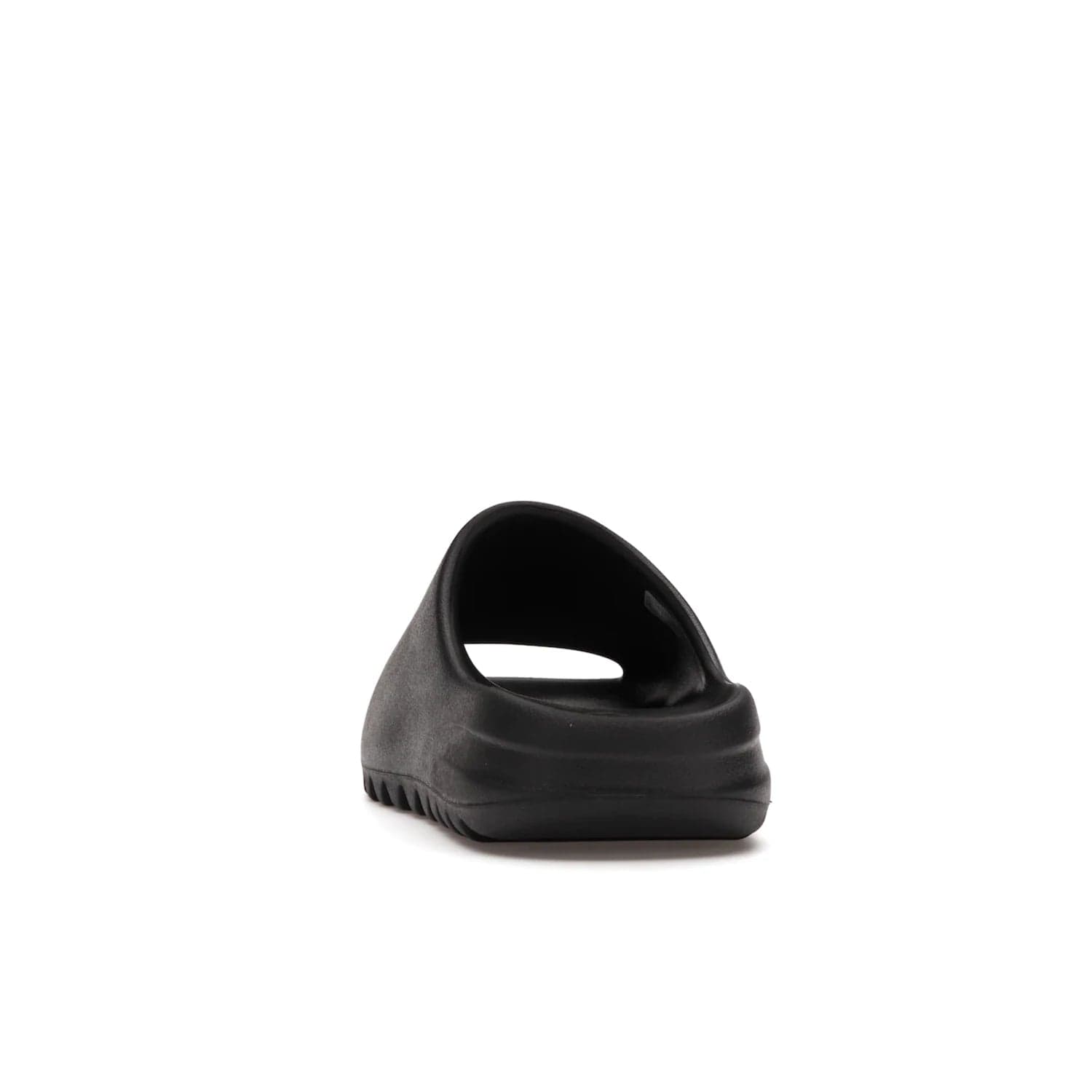 adidas Yeezy Slide Onyx - Image 27 - Only at www.BallersClubKickz.com - Step into comfort and style with the adidas Yeezy Slide Onyx. Featuring foam construction, an all-black colorway and a grooved outsole for stability and responsiveness, this versatile slide is a must-have for your collection.