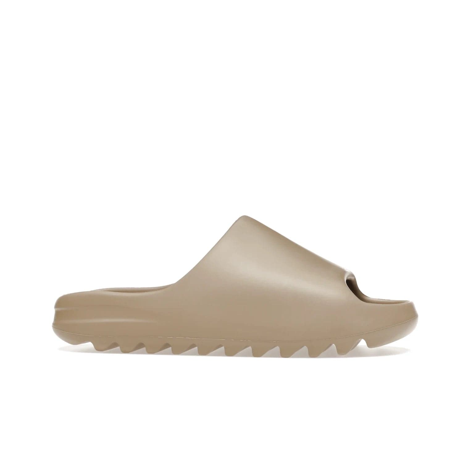 adidas Yeezy Slide Pure (First Release) - Image 2 - Only at www.BallersClubKickz.com - Shop the new adidas Yeezy Slide Pure at adidas. Crafted with a Pure EVA foam upper and soft footbed for instant comfort. Outsole with grooves offers traction & support for a perfect summer look. Available in Pure/Pure/Pure.