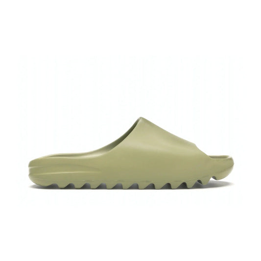 adidas Yeezy Slide Resin (2019/2021) - Image 1 - Only at www.BallersClubKickz.com - Step into fashion and function with the adidas Yeezy Slide Resin. Featuring a lightweight Resin EVA foam construction and an outsole with accentuated grooves for traction and support. The latest release is available in a Resin/Resin/Resin colorway, combining modern aesthetics and classic style. Step into style with the adidas Yeezy Slide Resin and be the trend-setter this season.
