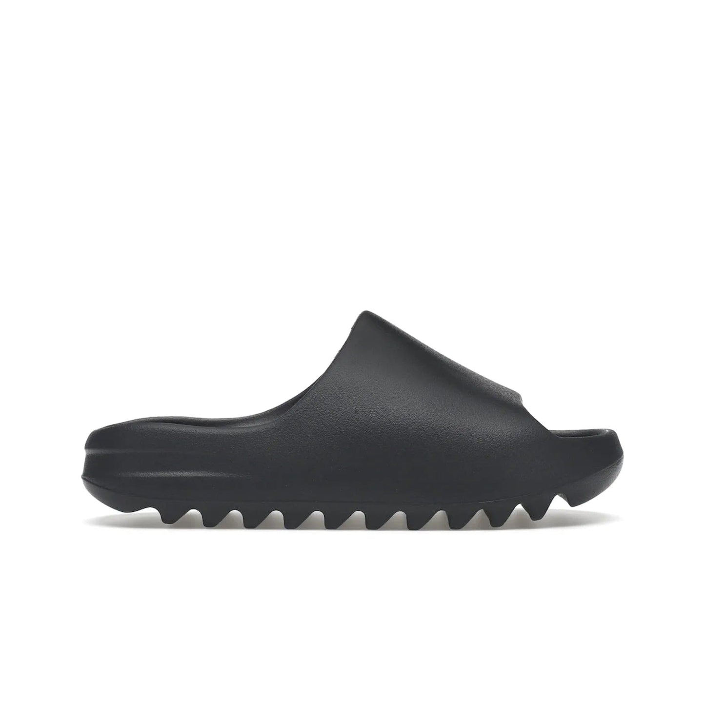 adidas Yeezy Slide Slate Grey - Image 1 - Only at www.BallersClubKickz.com - Stylish & comfortable adidas Yeezy Slide Slate Grey features an EVA foam upper, strategic cutouts, textured outsole pattern, & easy slip-on design for modern comfort & classic style.