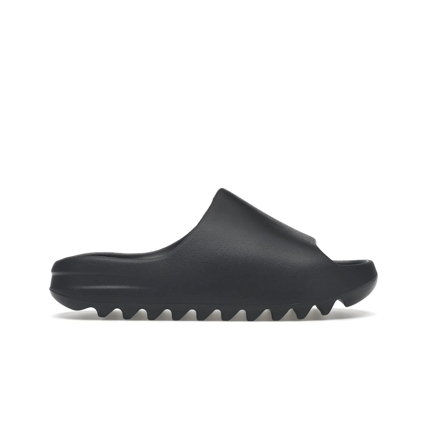 adidas Yeezy Slide Slate Grey - Image 1 - Only at www.BallersClubKickz.com - Stylish & comfortable adidas Yeezy Slide Slate Grey features an EVA foam upper, strategic cutouts, textured outsole pattern, & easy slip-on design for modern comfort & classic style.