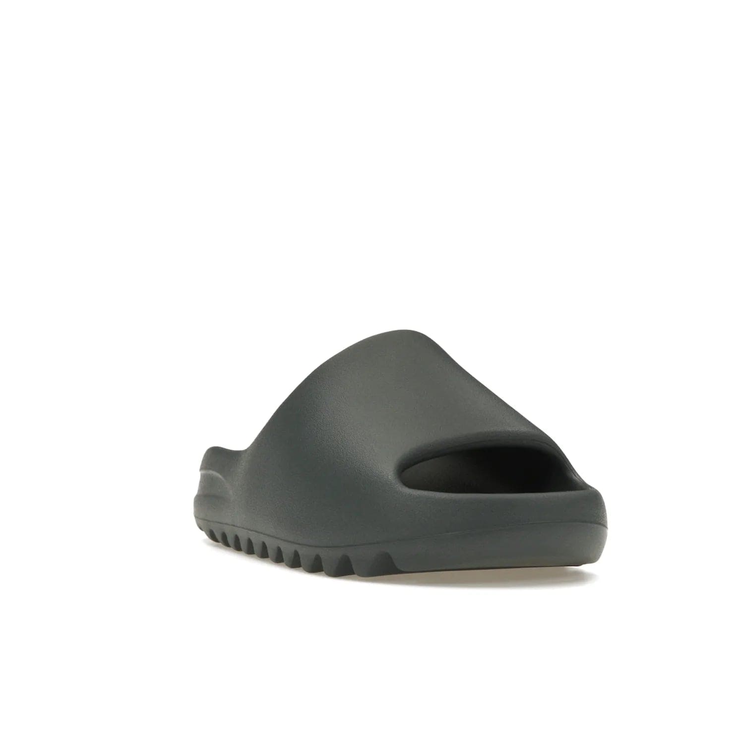 adidas Yeezy Slide Slate Marine - Image 7 - Only at www.BallersClubKickz.com - Discover the Adidas Yeezy Slide Slate Marine. With a Slate Marine colorway, contrasting outsole, and matching strap, these sandals make a timeless fashion statement. Out August 11th, 2023.