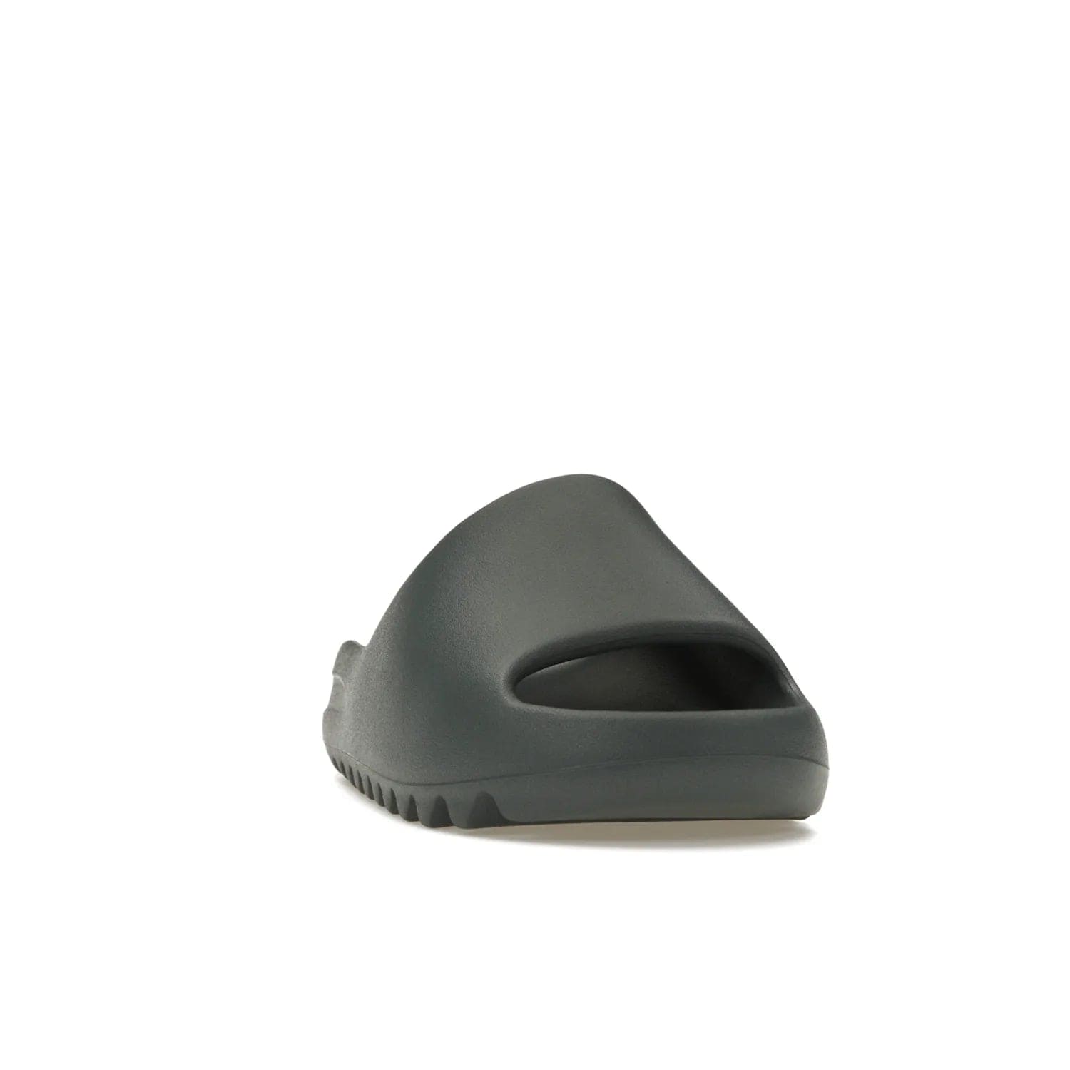 adidas Yeezy Slide Slate Marine - Image 8 - Only at www.BallersClubKickz.com - Discover the Adidas Yeezy Slide Slate Marine. With a Slate Marine colorway, contrasting outsole, and matching strap, these sandals make a timeless fashion statement. Out August 11th, 2023.
