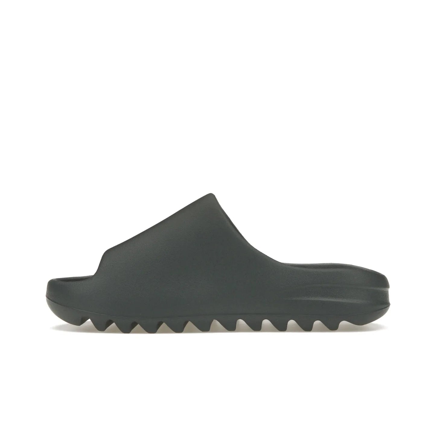 adidas Yeezy Slide Slate Marine - Image 19 - Only at www.BallersClubKickz.com - Discover the Adidas Yeezy Slide Slate Marine. With a Slate Marine colorway, contrasting outsole, and matching strap, these sandals make a timeless fashion statement. Out August 11th, 2023.