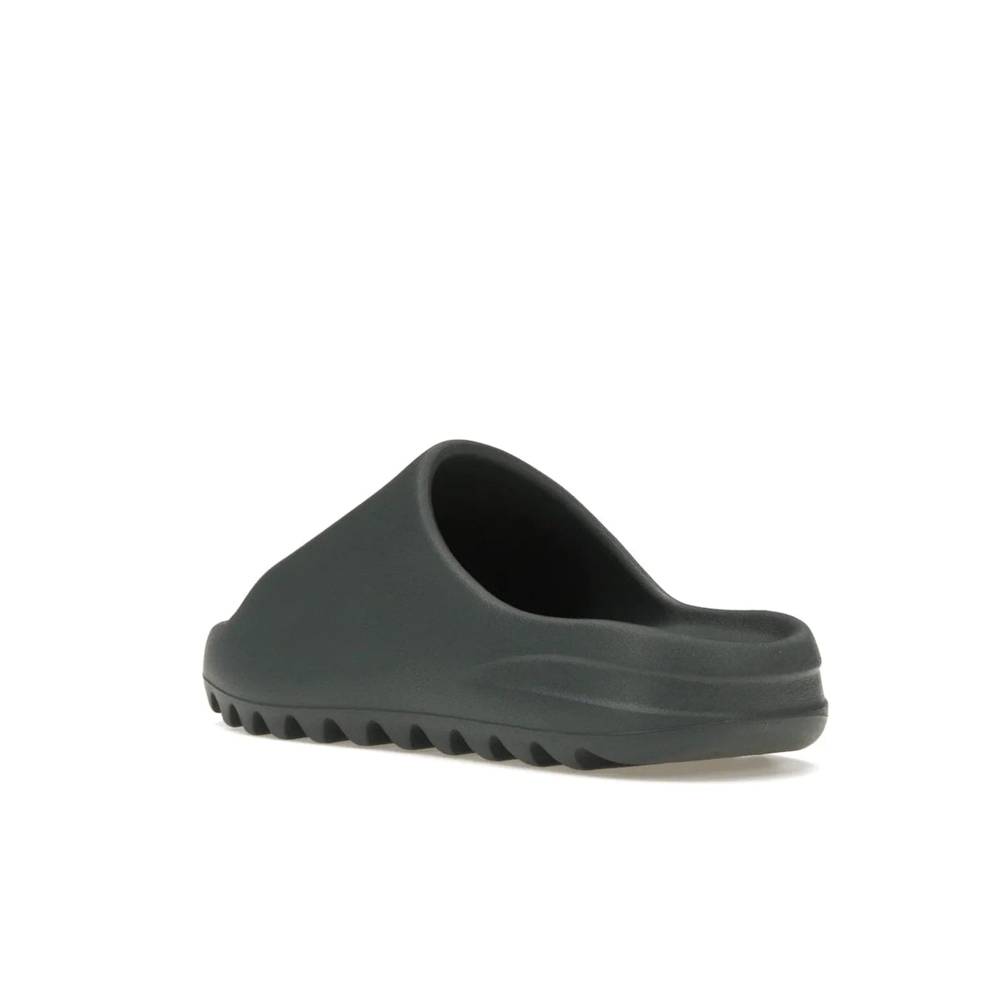 adidas Yeezy Slide Slate Marine - Image 24 - Only at www.BallersClubKickz.com - Discover the Adidas Yeezy Slide Slate Marine. With a Slate Marine colorway, contrasting outsole, and matching strap, these sandals make a timeless fashion statement. Out August 11th, 2023.