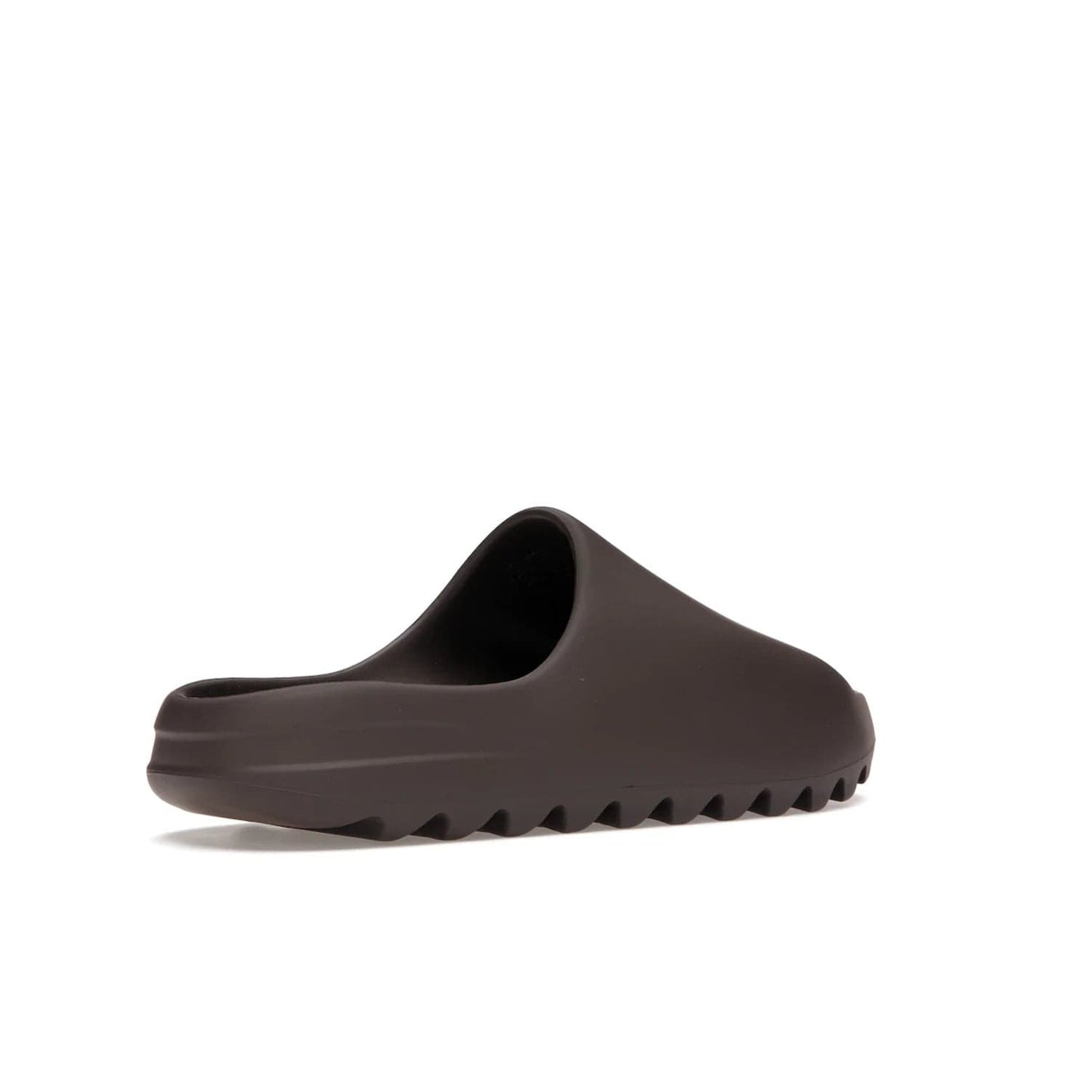 adidas Yeezy Slide Soot - Image 33 - Only at www.BallersClubKickz.com - Shop the Yeezy Slide Soot sneaker by Adidas, a sleek blend of form and function. Monochrome silhouette in Soot/Soot/Soot. Lightweight EVA foam offers comfort and durability. Get the must-have style today.
