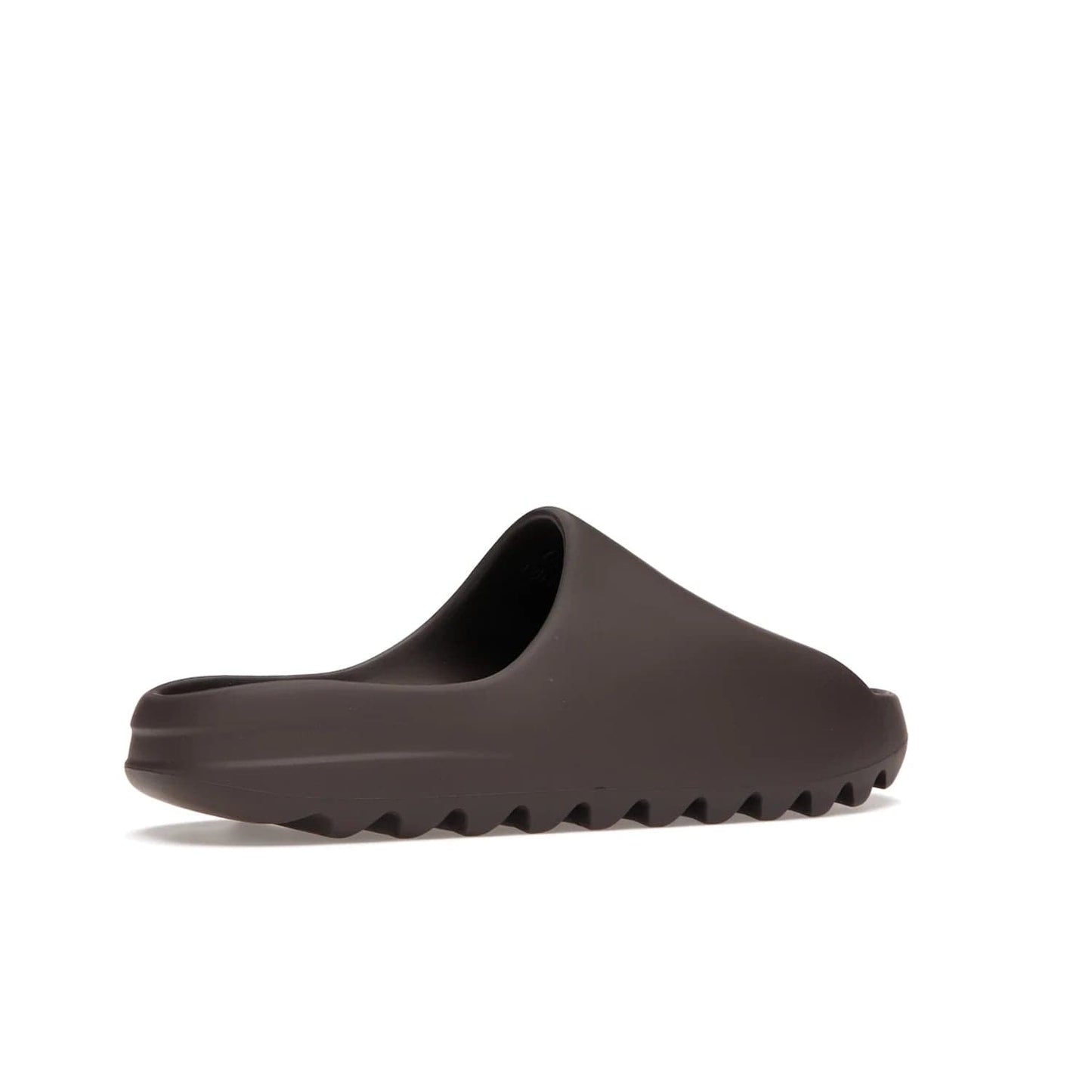 adidas Yeezy Slide Soot - Image 34 - Only at www.BallersClubKickz.com - Shop the Yeezy Slide Soot sneaker by Adidas, a sleek blend of form and function. Monochrome silhouette in Soot/Soot/Soot. Lightweight EVA foam offers comfort and durability. Get the must-have style today.