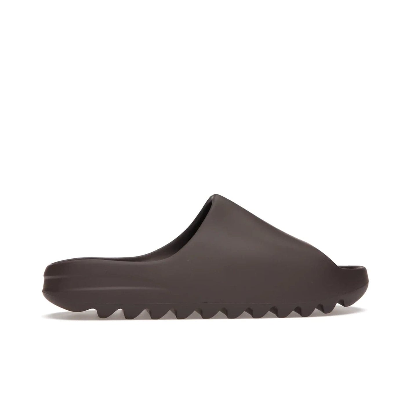 adidas Yeezy Slide Soot - Image 36 - Only at www.BallersClubKickz.com - Shop the Yeezy Slide Soot sneaker by Adidas, a sleek blend of form and function. Monochrome silhouette in Soot/Soot/Soot. Lightweight EVA foam offers comfort and durability. Get the must-have style today.