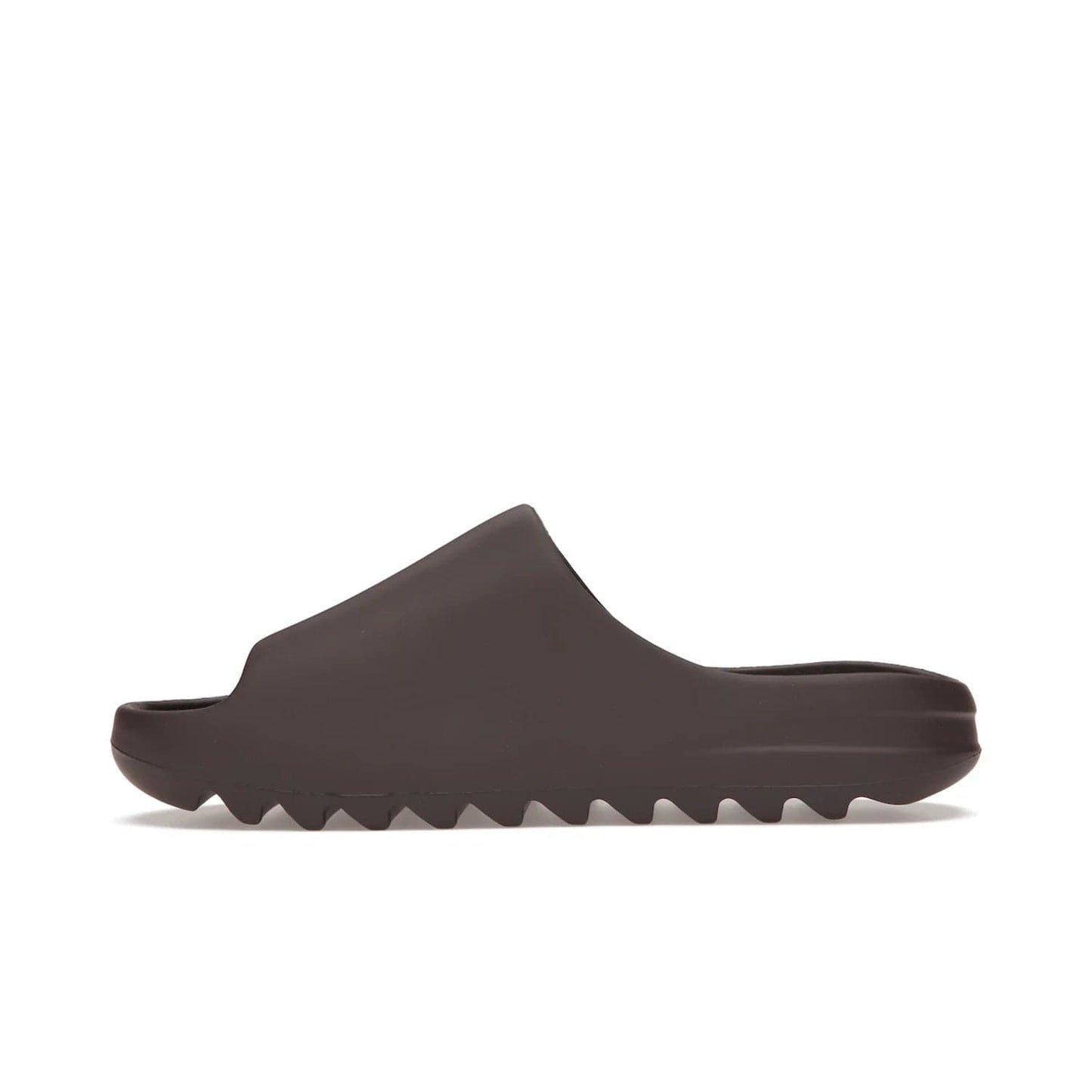 adidas Yeezy Slide Soot - Image 19 - Only at www.BallersClubKickz.com - Shop the Yeezy Slide Soot sneaker by Adidas, a sleek blend of form and function. Monochrome silhouette in Soot/Soot/Soot. Lightweight EVA foam offers comfort and durability. Get the must-have style today.