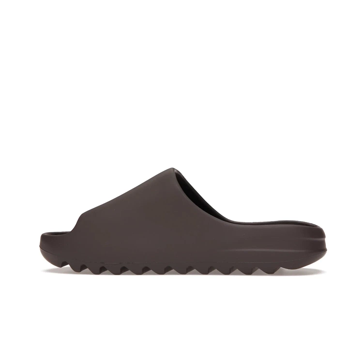 adidas Yeezy Slide Soot - Image 20 - Only at www.BallersClubKickz.com - Shop the Yeezy Slide Soot sneaker by Adidas, a sleek blend of form and function. Monochrome silhouette in Soot/Soot/Soot. Lightweight EVA foam offers comfort and durability. Get the must-have style today.