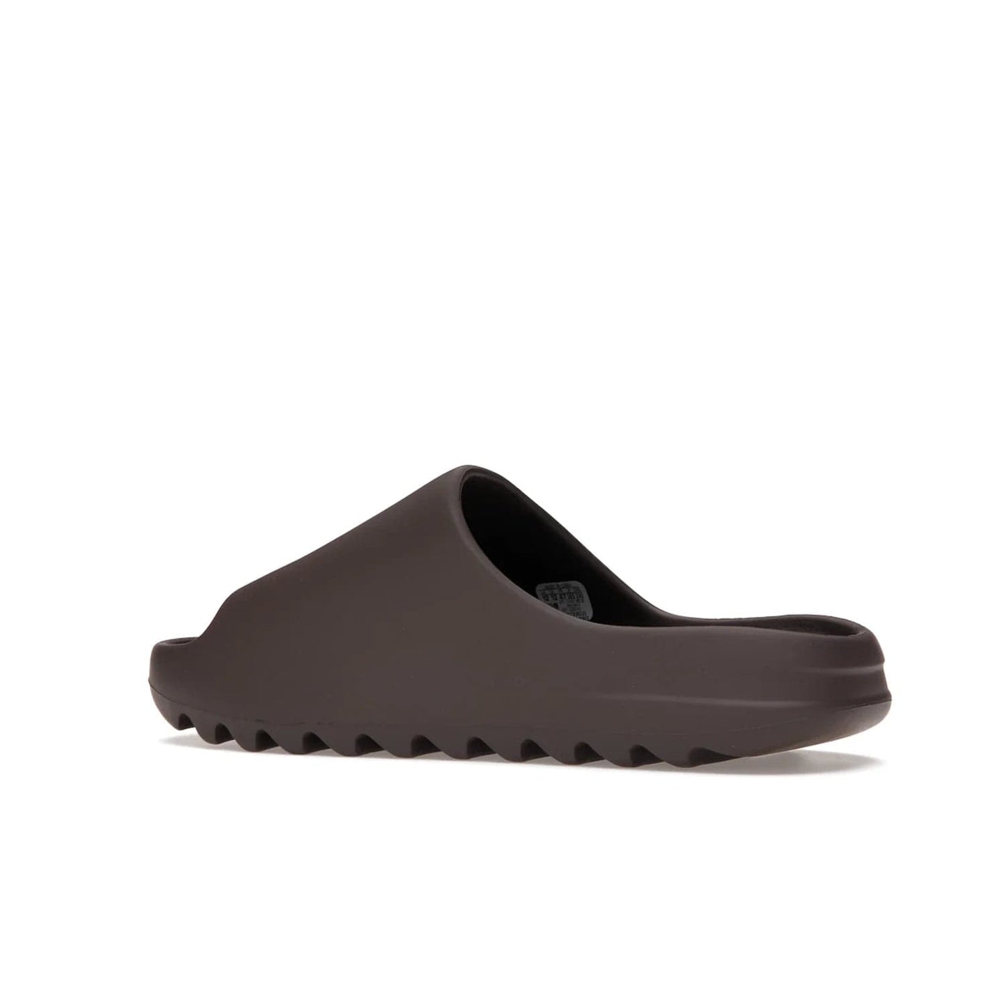adidas Yeezy Slide Soot - Image 22 - Only at www.BallersClubKickz.com - Shop the Yeezy Slide Soot sneaker by Adidas, a sleek blend of form and function. Monochrome silhouette in Soot/Soot/Soot. Lightweight EVA foam offers comfort and durability. Get the must-have style today.