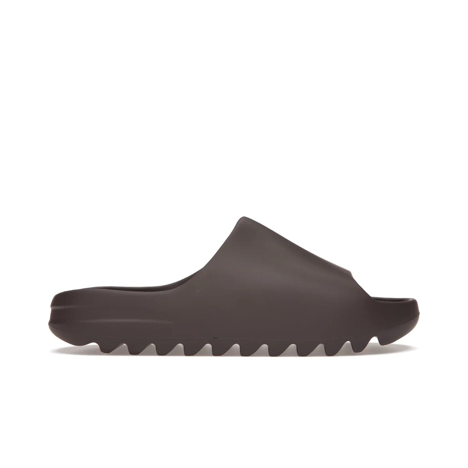 adidas Yeezy Slide Soot - Image 1 - Only at www.BallersClubKickz.com - Shop the Yeezy Slide Soot sneaker by Adidas, a sleek blend of form and function. Monochrome silhouette in Soot/Soot/Soot. Lightweight EVA foam offers comfort and durability. Get the must-have style today.