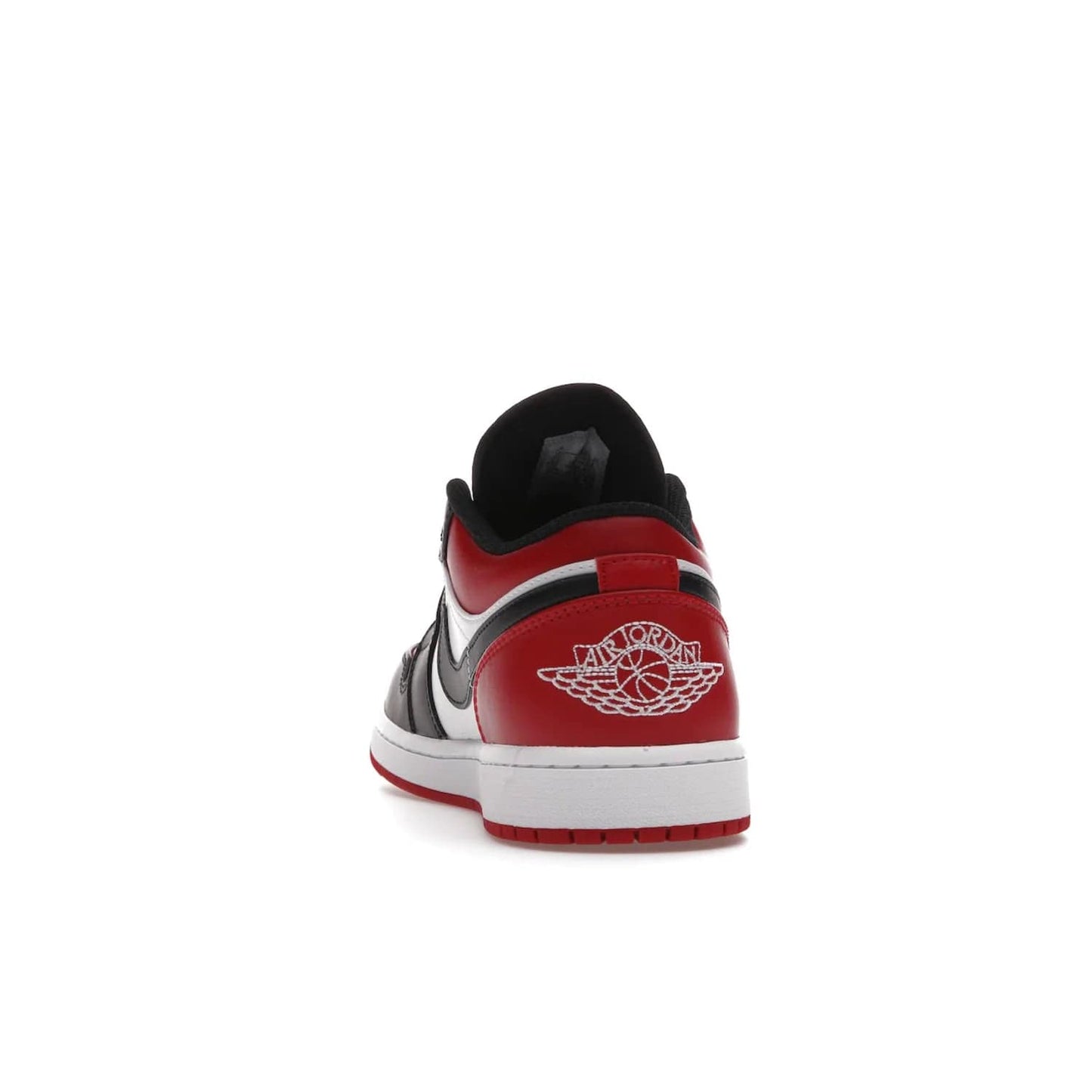 Jordan 1 Low Bred Toe - Image 27 - Only at www.BallersClubKickz.com - Step into the iconic Jordan 1 Retro. Mixing and matching of leather in red, black, and white makes for a unique colorway. Finished off with a Wing logo embroidery & Jumpman label. Comfortable and stylish at an affordable $100, the Jordan 1 Low Bred Toe is perfect for any true sneaker fan.