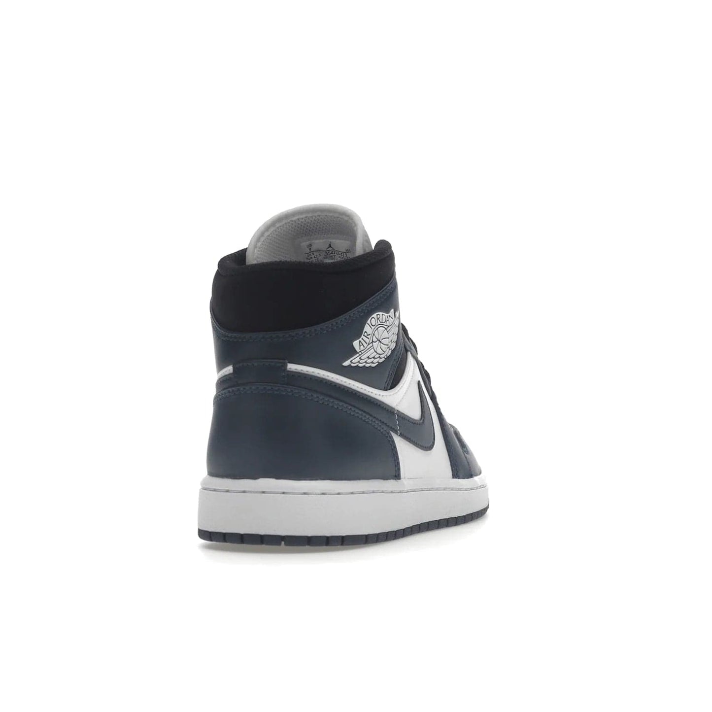 Jordan 1 Mid Armory Navy - Image 30 - Only at www.BallersClubKickz.com - The Jordan 1 Mid Armory Navy: classic basketball sneaker with soft white leather upper, deep navy blue overlays, and black leather ankle detailing. Iconic style with Jordan Wings logo and Jumpman label.