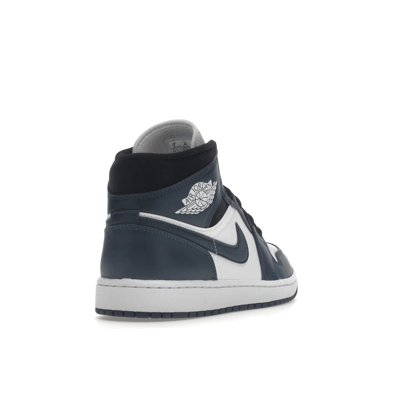 Jordan 1 Mid Armory Navy - Image 31 - Only at www.BallersClubKickz.com - The Jordan 1 Mid Armory Navy: classic basketball sneaker with soft white leather upper, deep navy blue overlays, and black leather ankle detailing. Iconic style with Jordan Wings logo and Jumpman label.