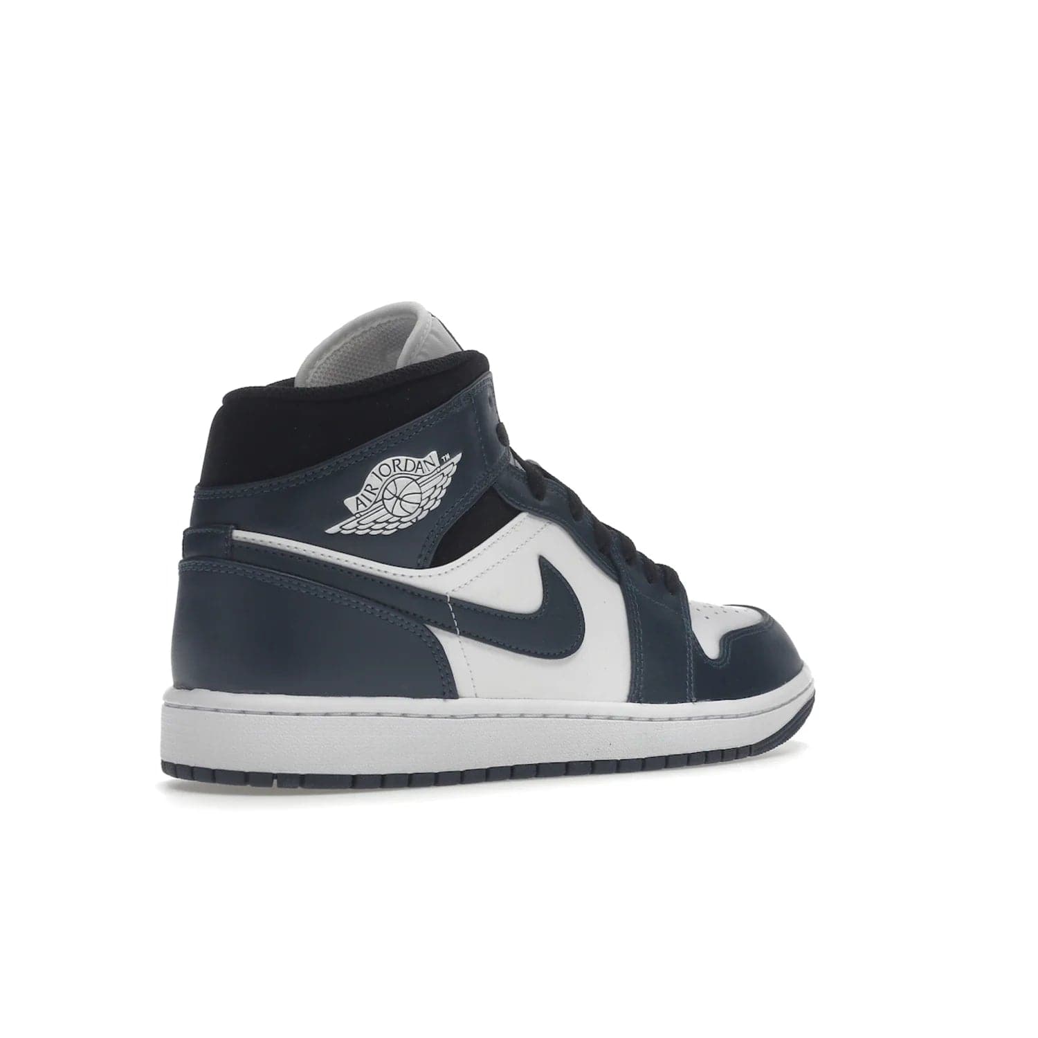 Jordan 1 Mid Armory Navy - Image 33 - Only at www.BallersClubKickz.com - The Jordan 1 Mid Armory Navy: classic basketball sneaker with soft white leather upper, deep navy blue overlays, and black leather ankle detailing. Iconic style with Jordan Wings logo and Jumpman label.